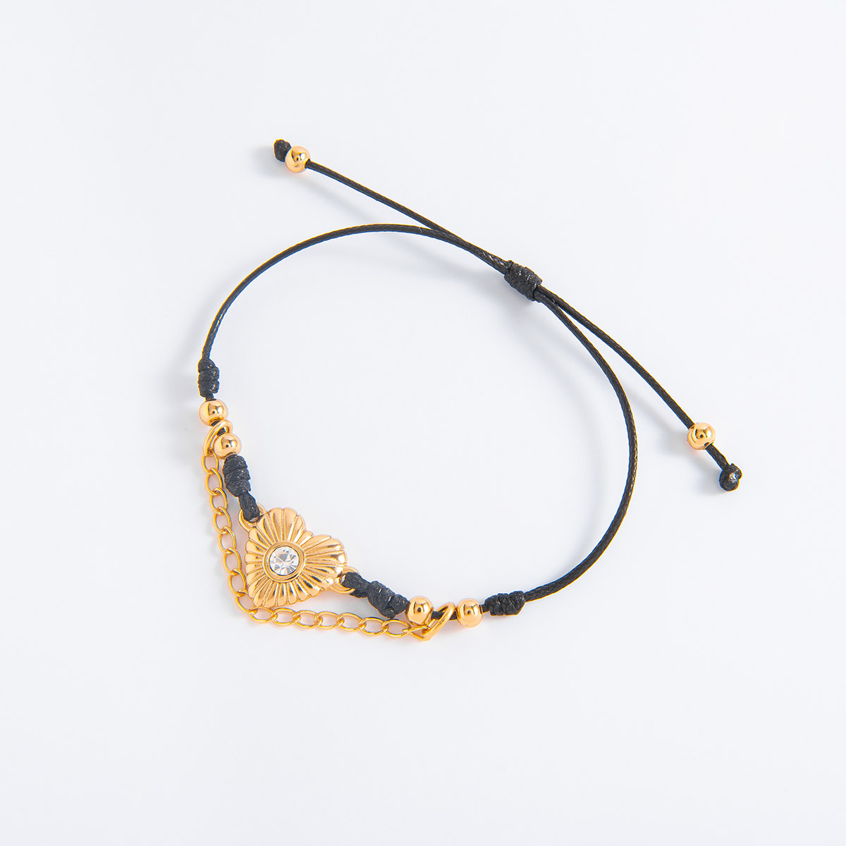 Pulsera de cordón negro con baño de oro y cristal