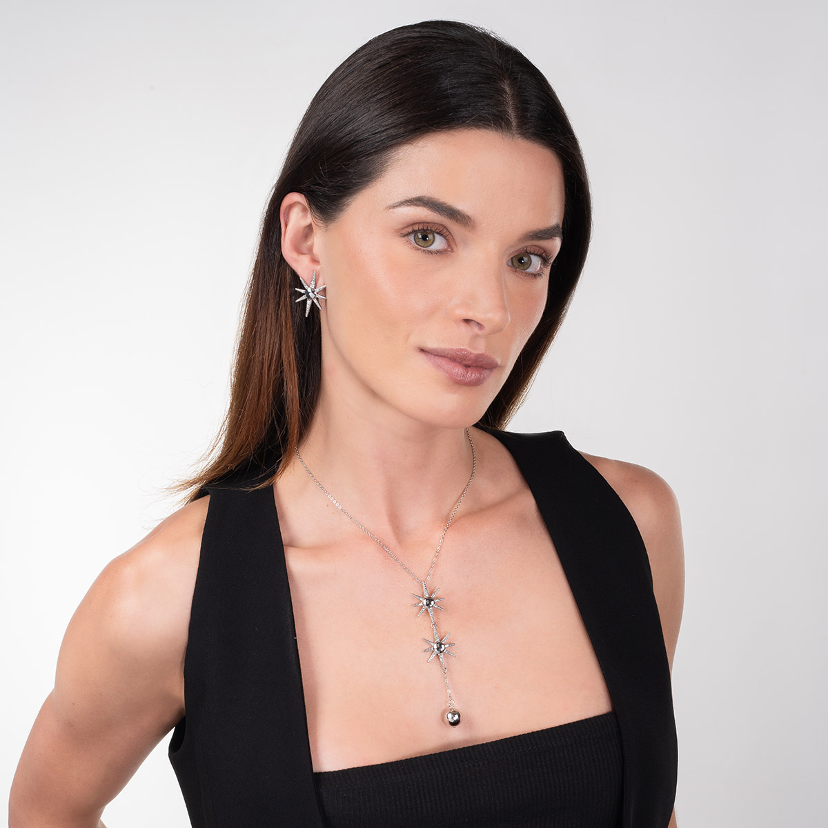 Aretes en baño de rodio estrella piedras toque brillante