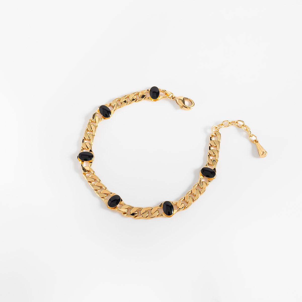 Pulsera en baño de oro eslabones piedras negras diseño moderno