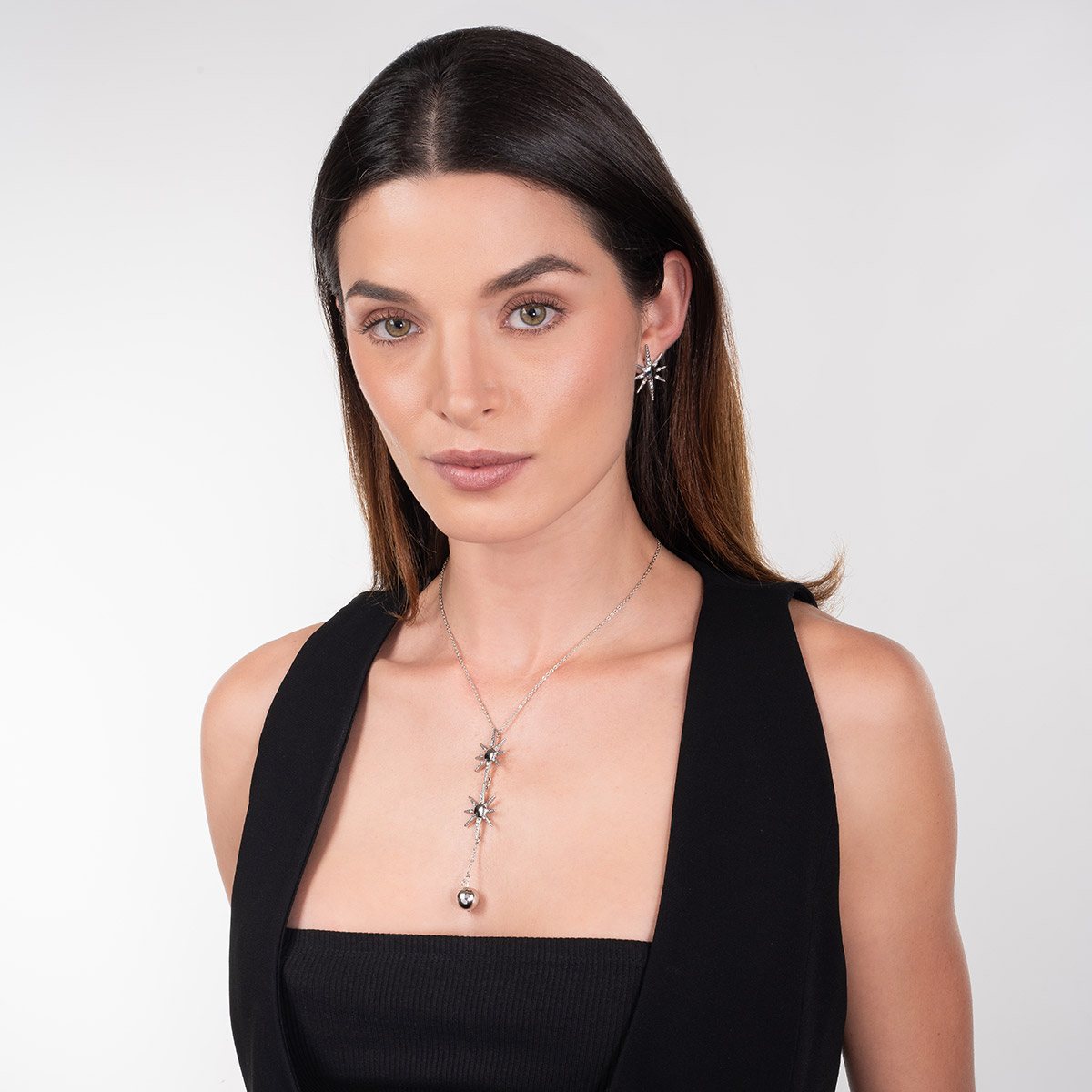 Aretes en baño de rodio estrella piedras toque brillante