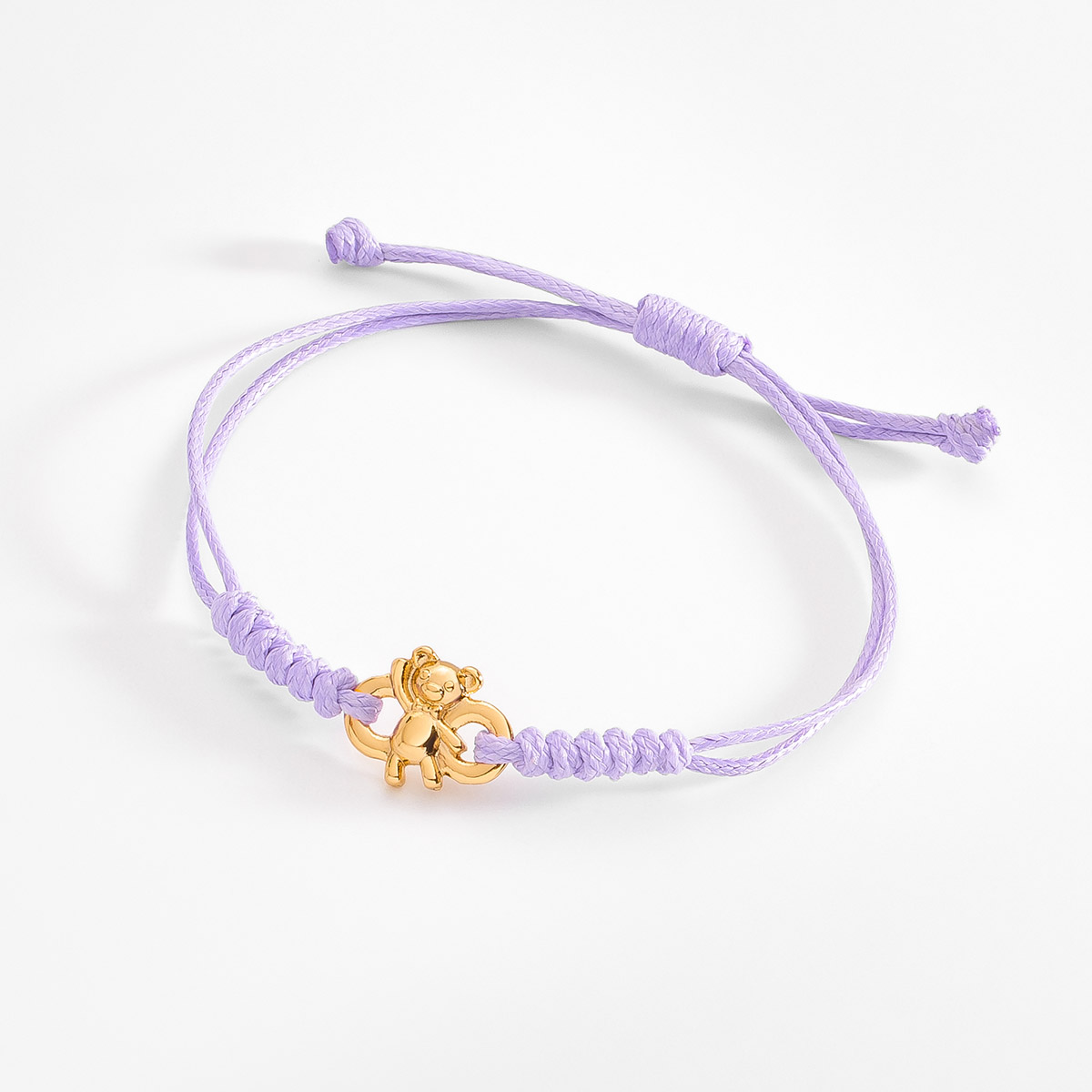 Pulsera con cordón lila y dije de oso en oro