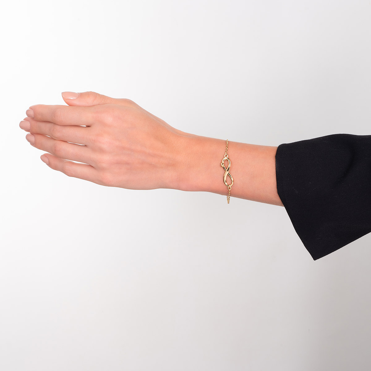 Pulsera en baño de oro con dije infinito pulido