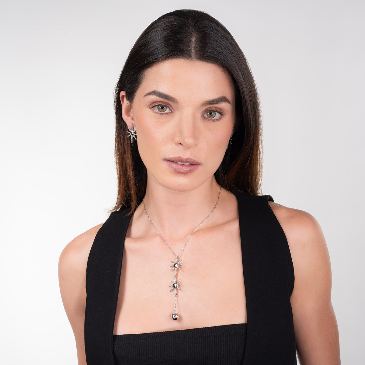 Aretes en baño de rodio estrella piedras toque brillante