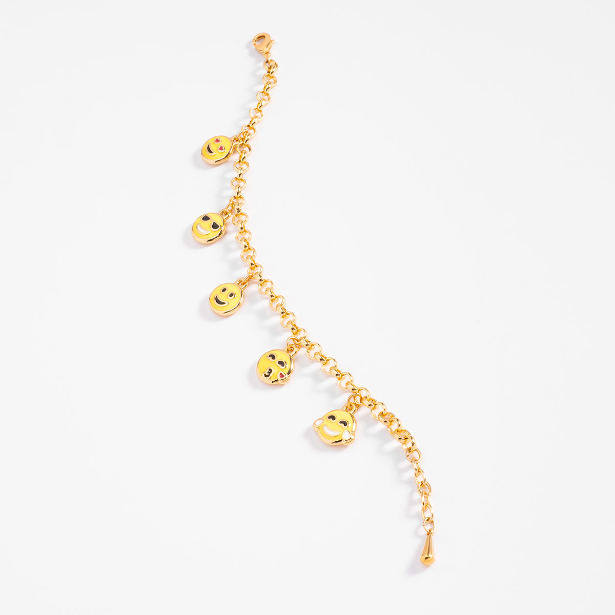 Pulsera en baño de oro con dijes de caritas divertidas