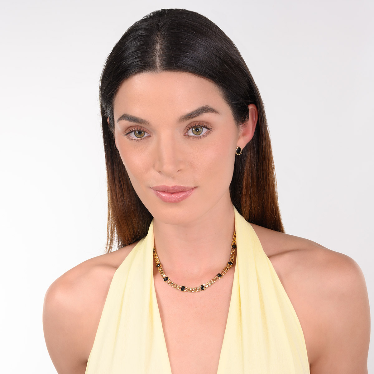 Aretes en baño de oro piedra negra diseño ovalado moderno