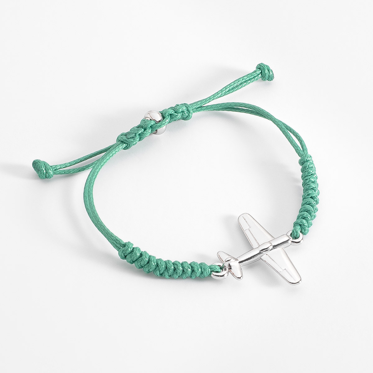 Pulsera aventurera con cordón verde y dije avión