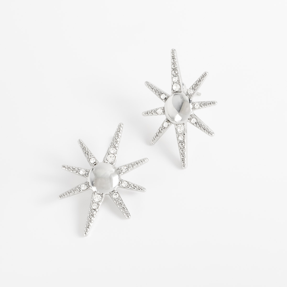 Aretes en baño de rodio estrella piedras toque brillante