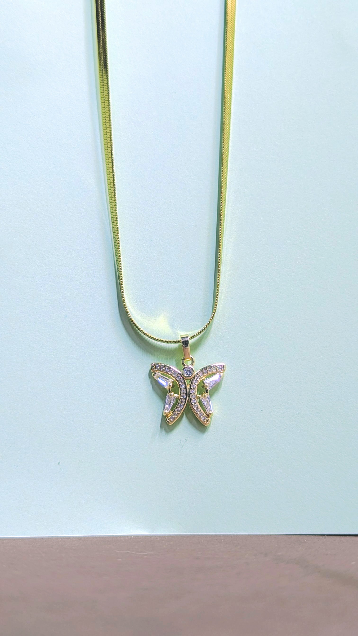 Gold necklace with butterfly pendant