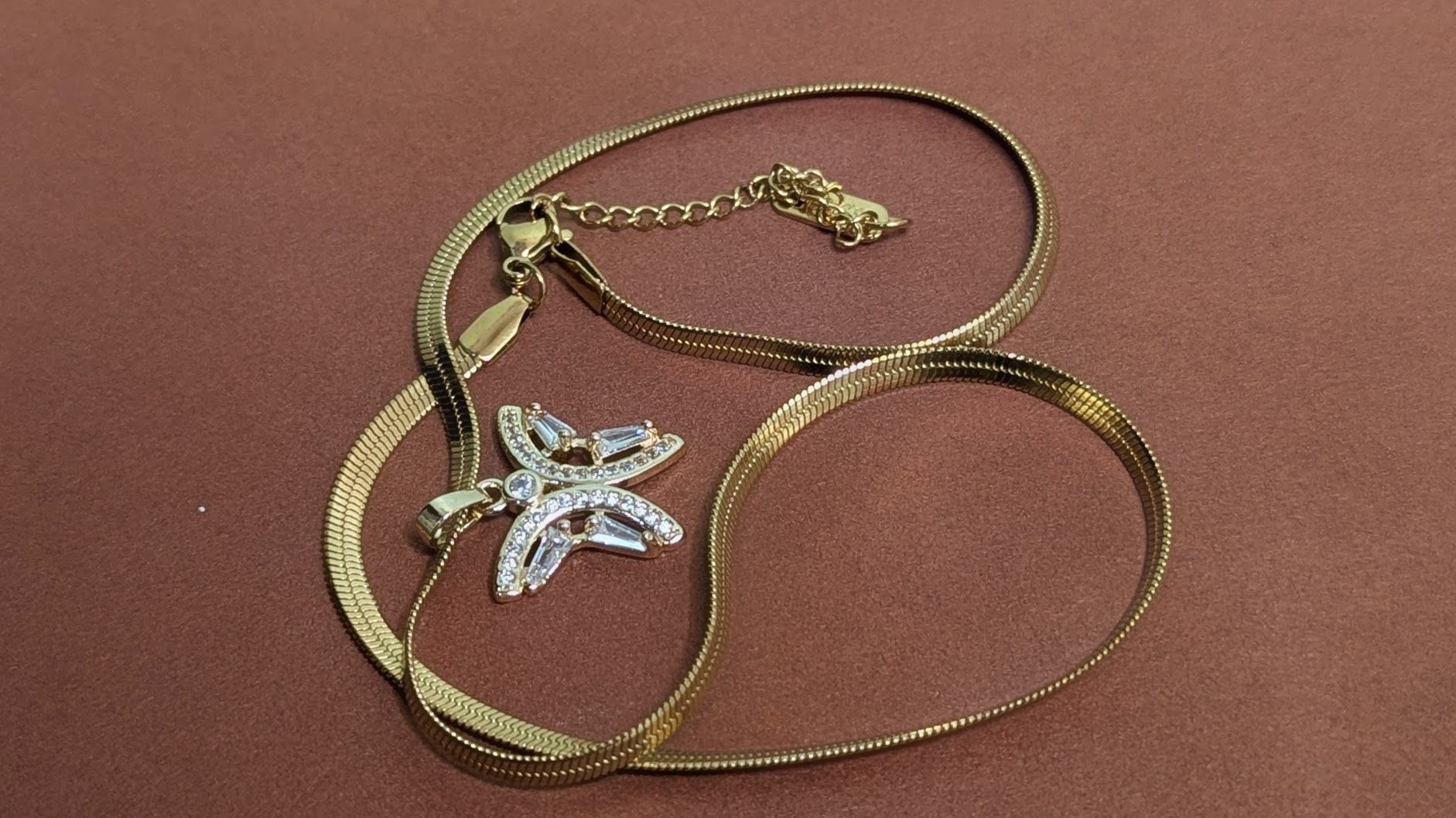 Gold necklace with butterfly pendant