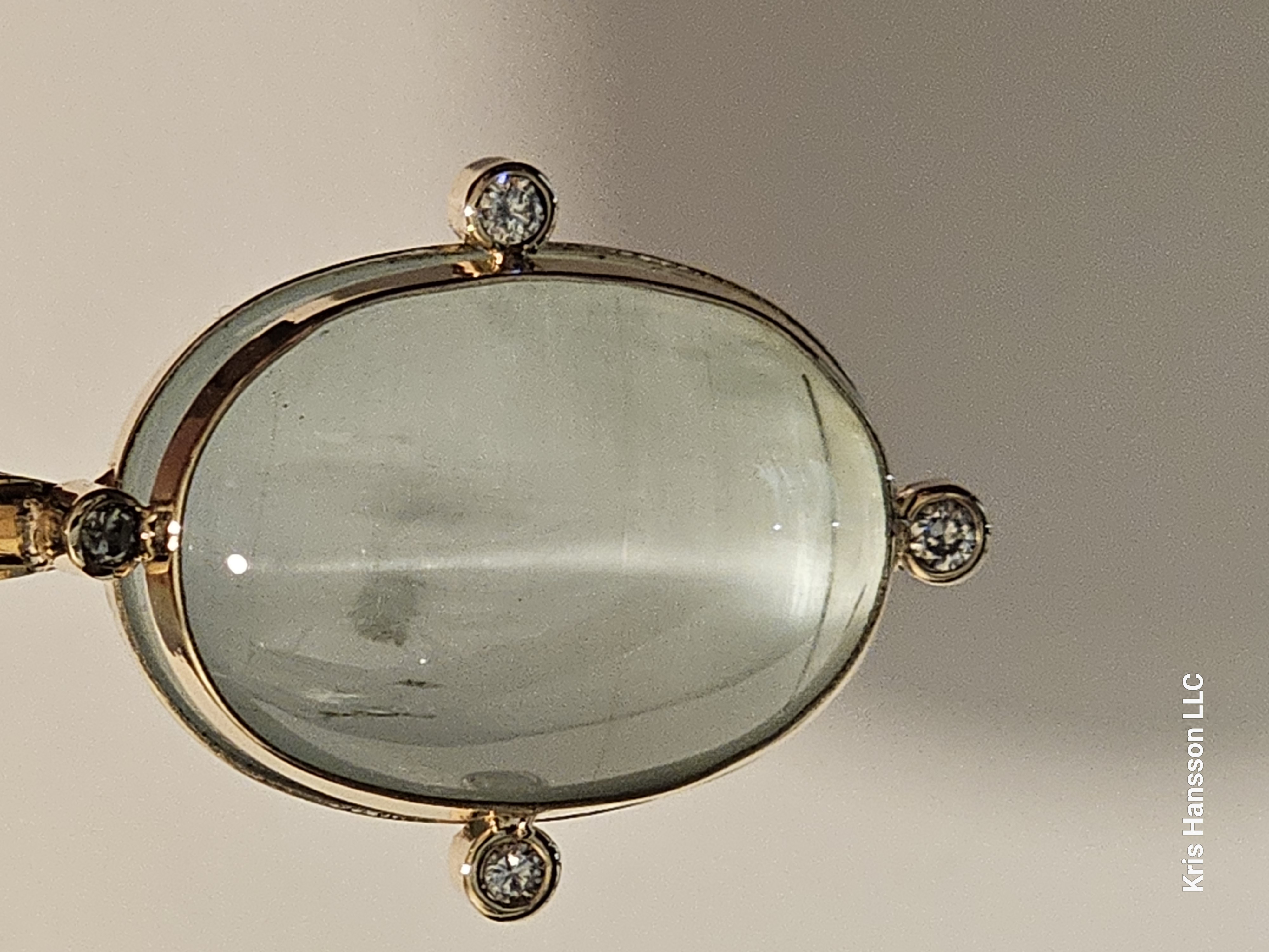 58.50ct. Natural Aquamarine Cat's Eye in 14K yellow gold with diamonds