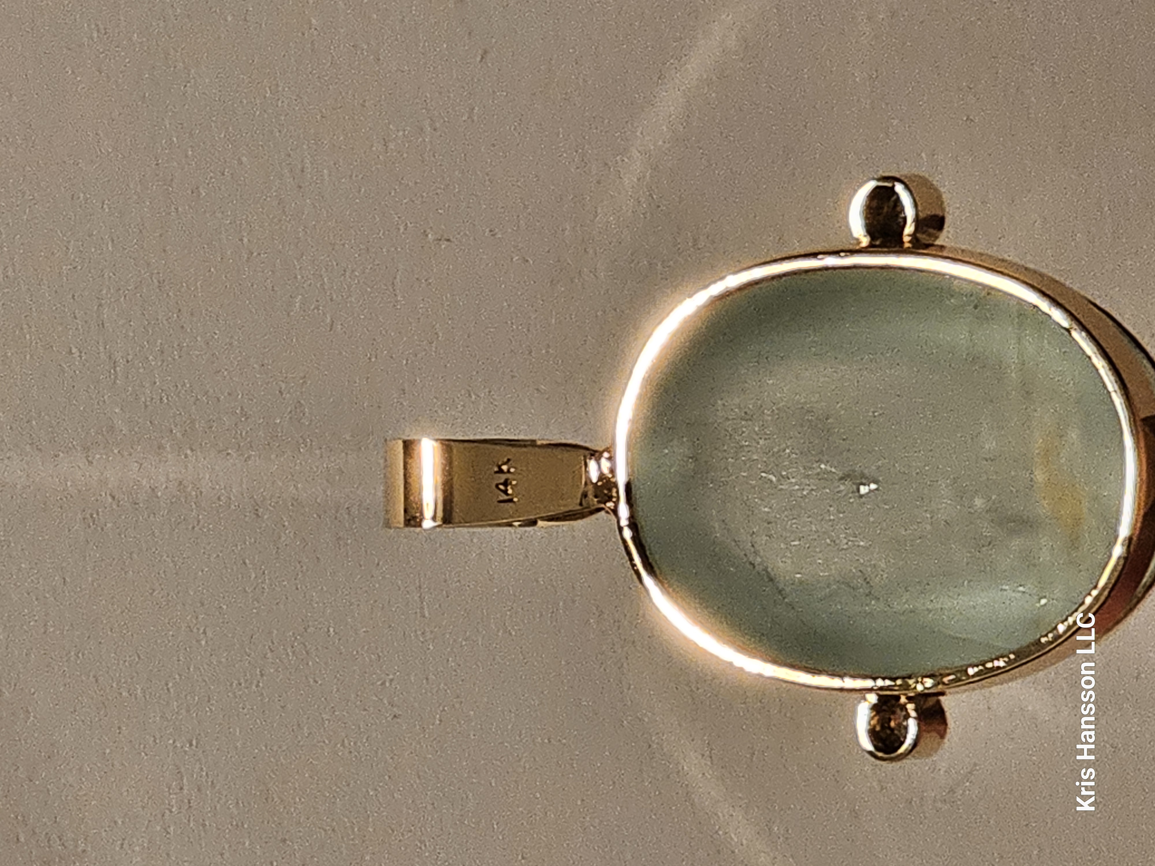 58.50ct. Natural Aquamarine Cat's Eye in 14K yellow gold with diamonds