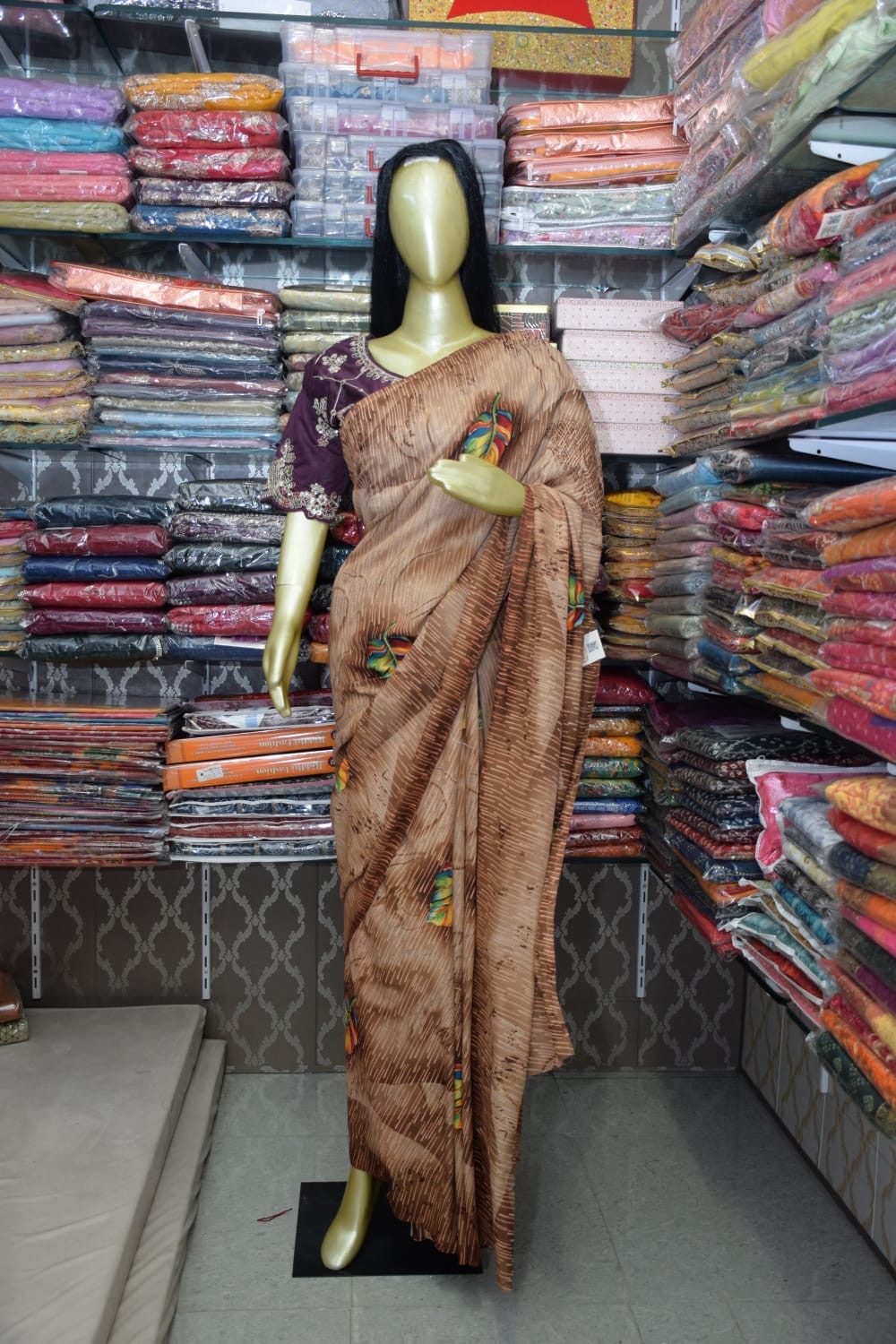 Elegant Brown Saree with Embroidered Details