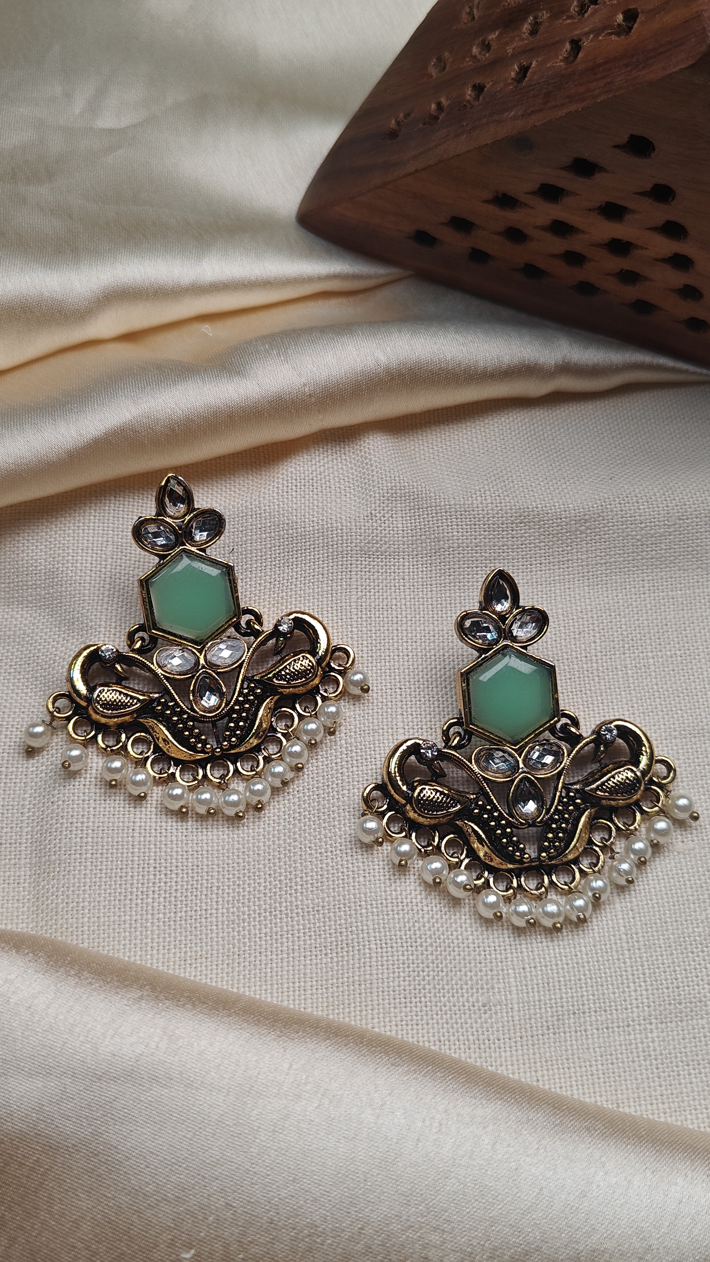 Golden peacock earrings with green stone & pearl drops