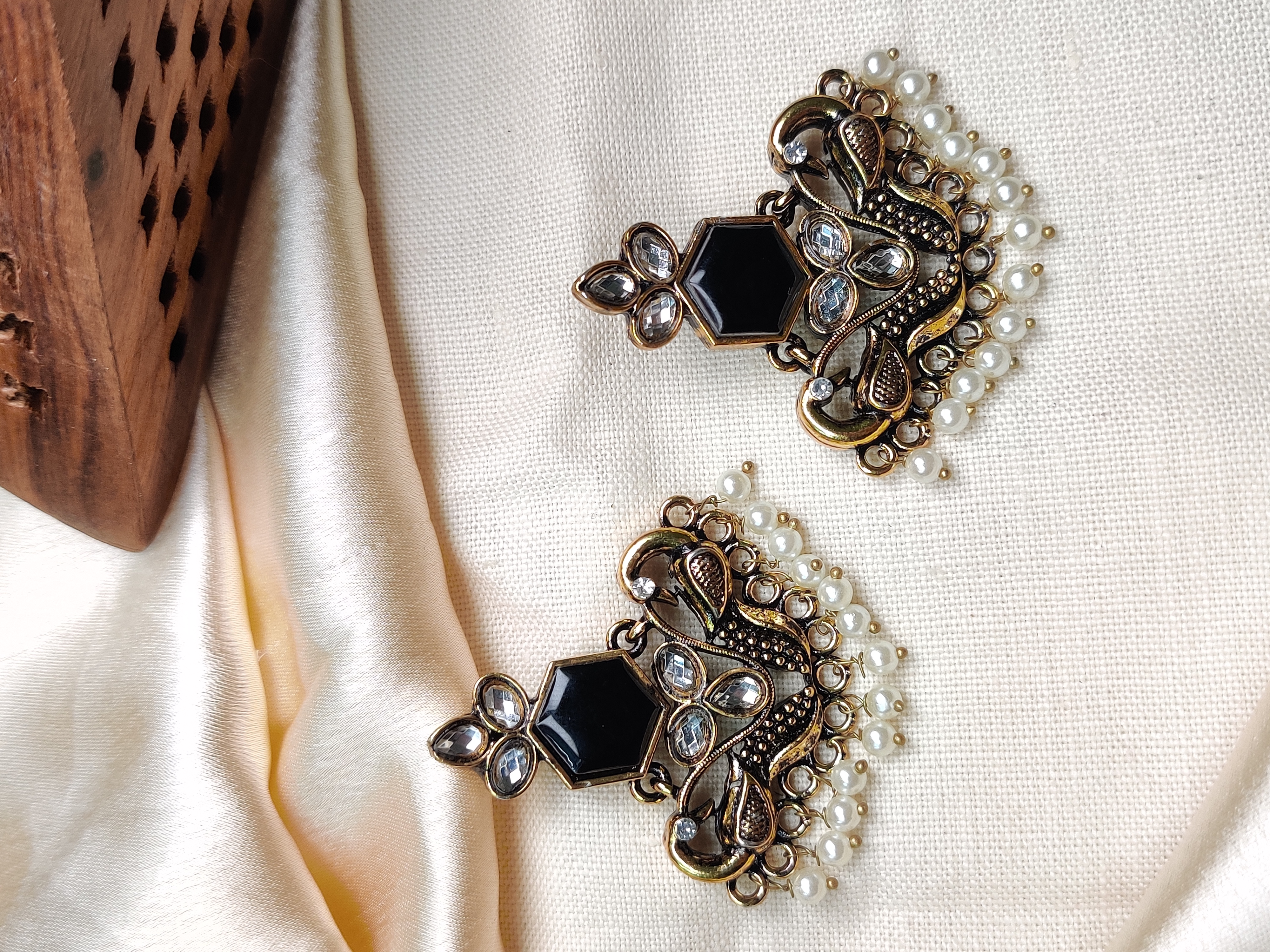 Golden peacock earrings with black stone & pearl drops