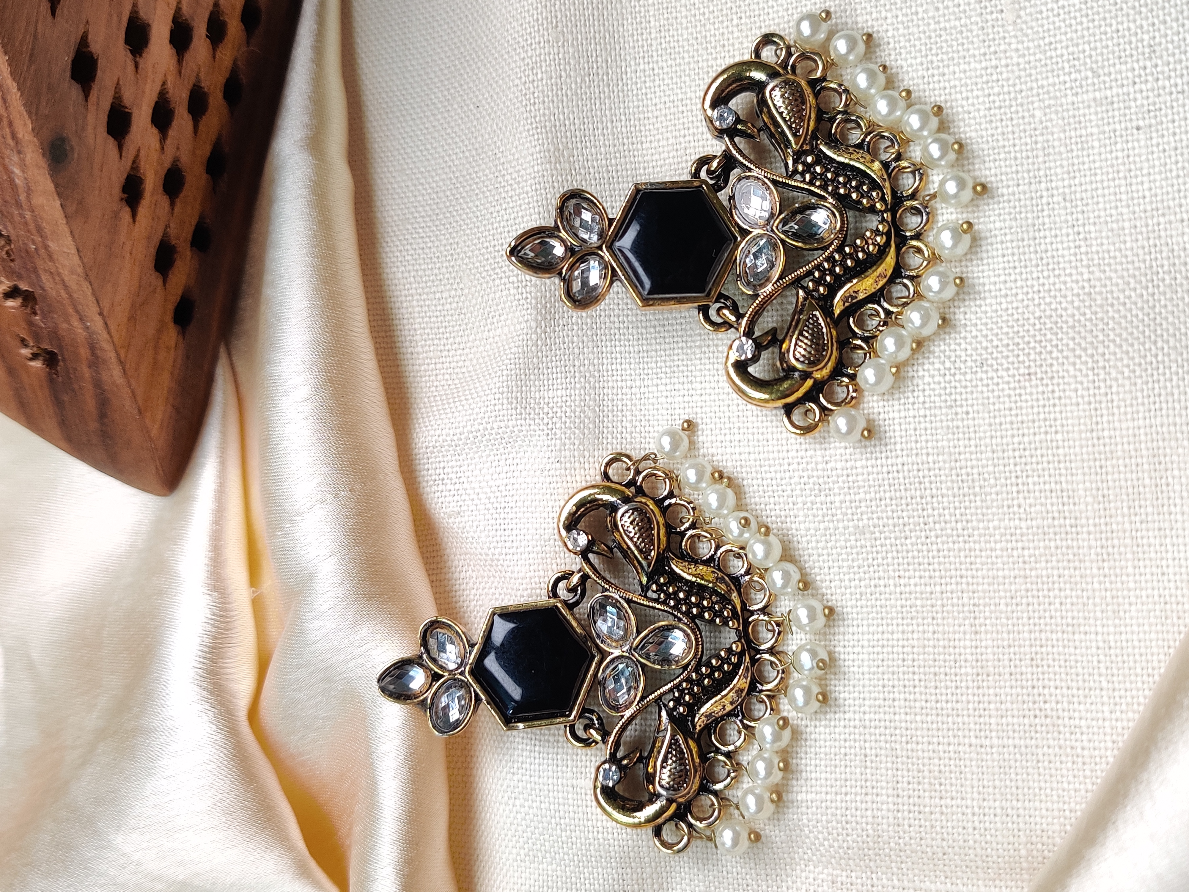 Golden peacock earrings with black stone & pearl drops 