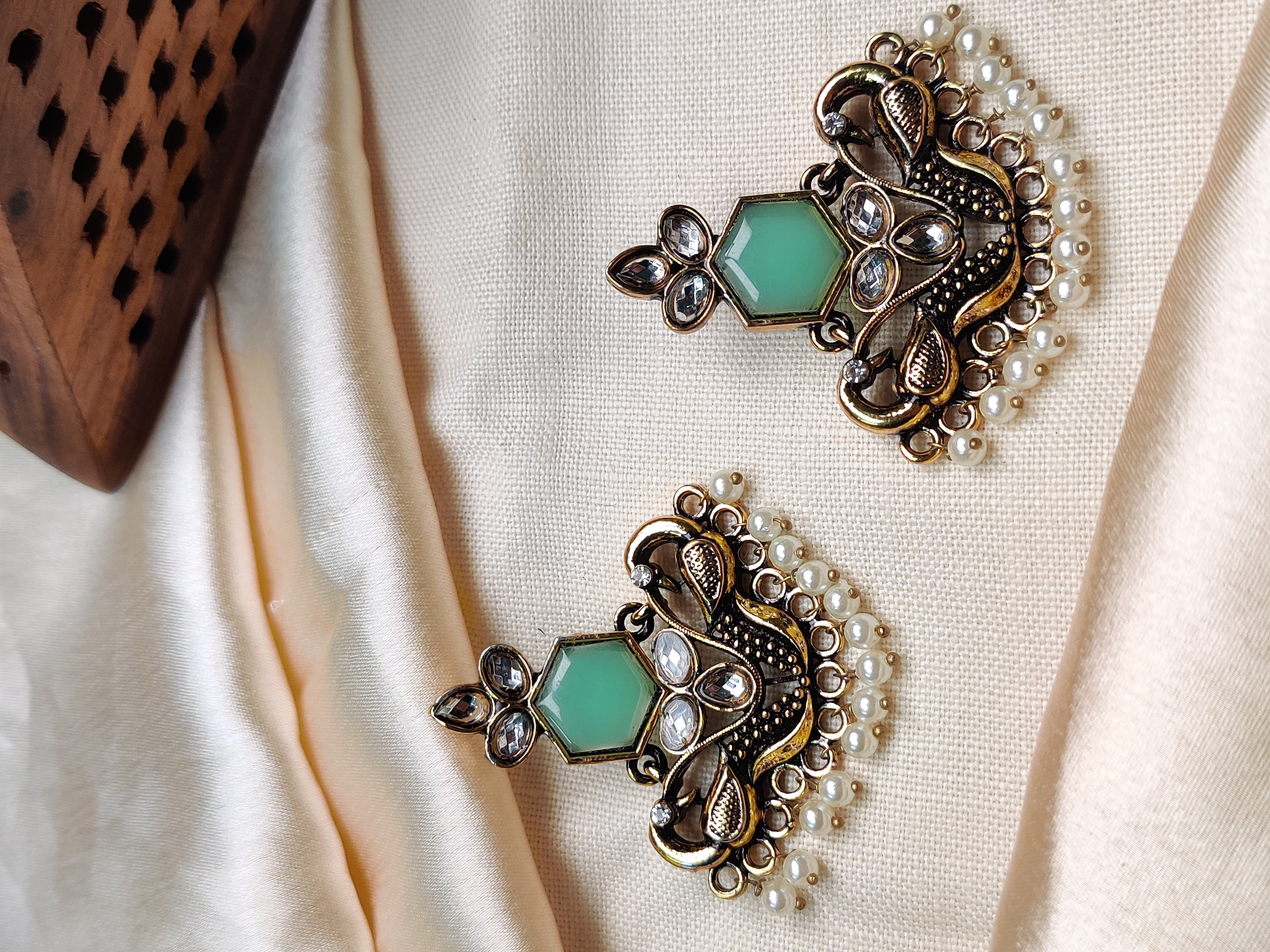 Golden peacock earrings with green stone & pearl drops