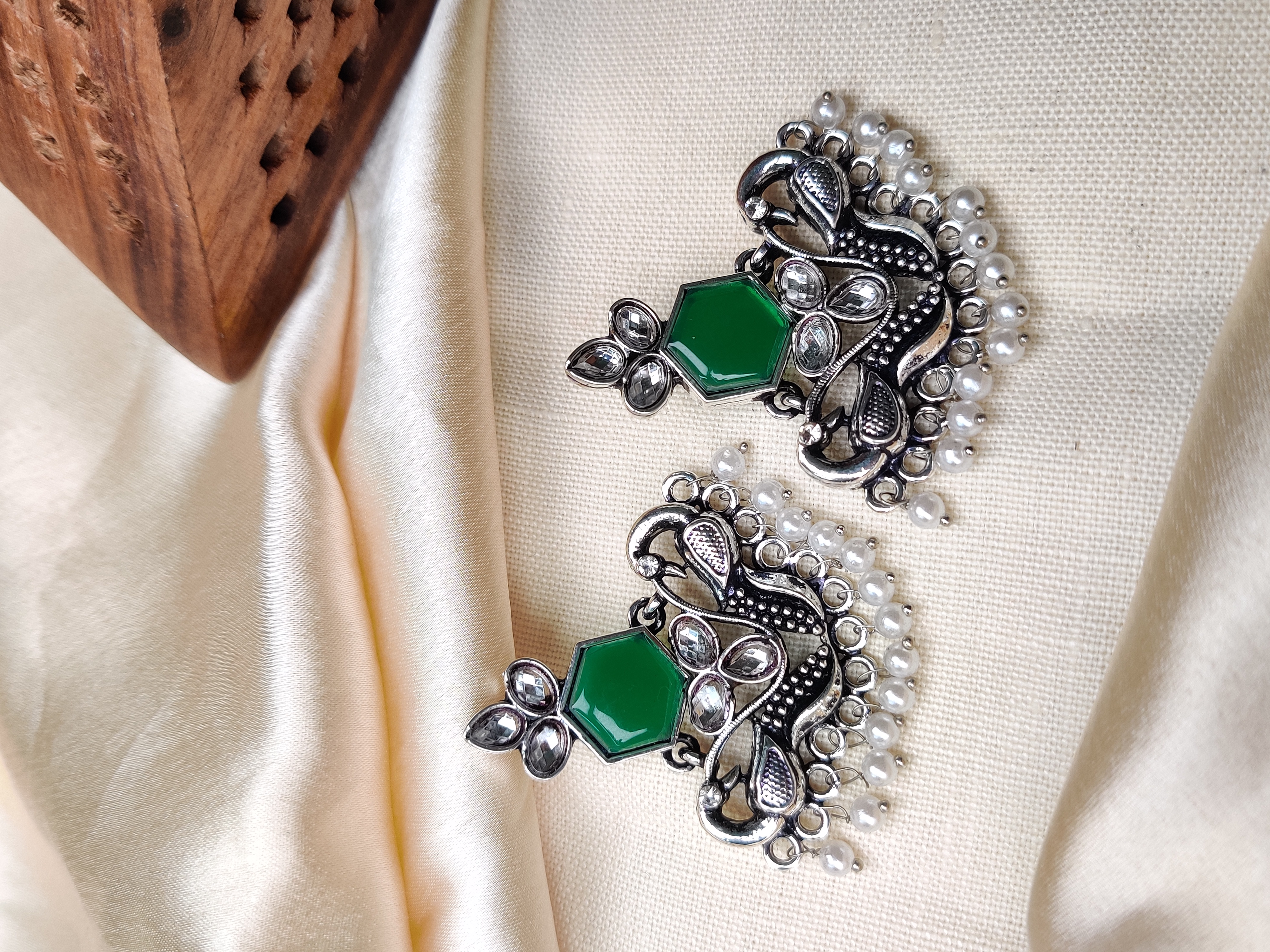 Silver peacock earrings with green stone & pearl beads