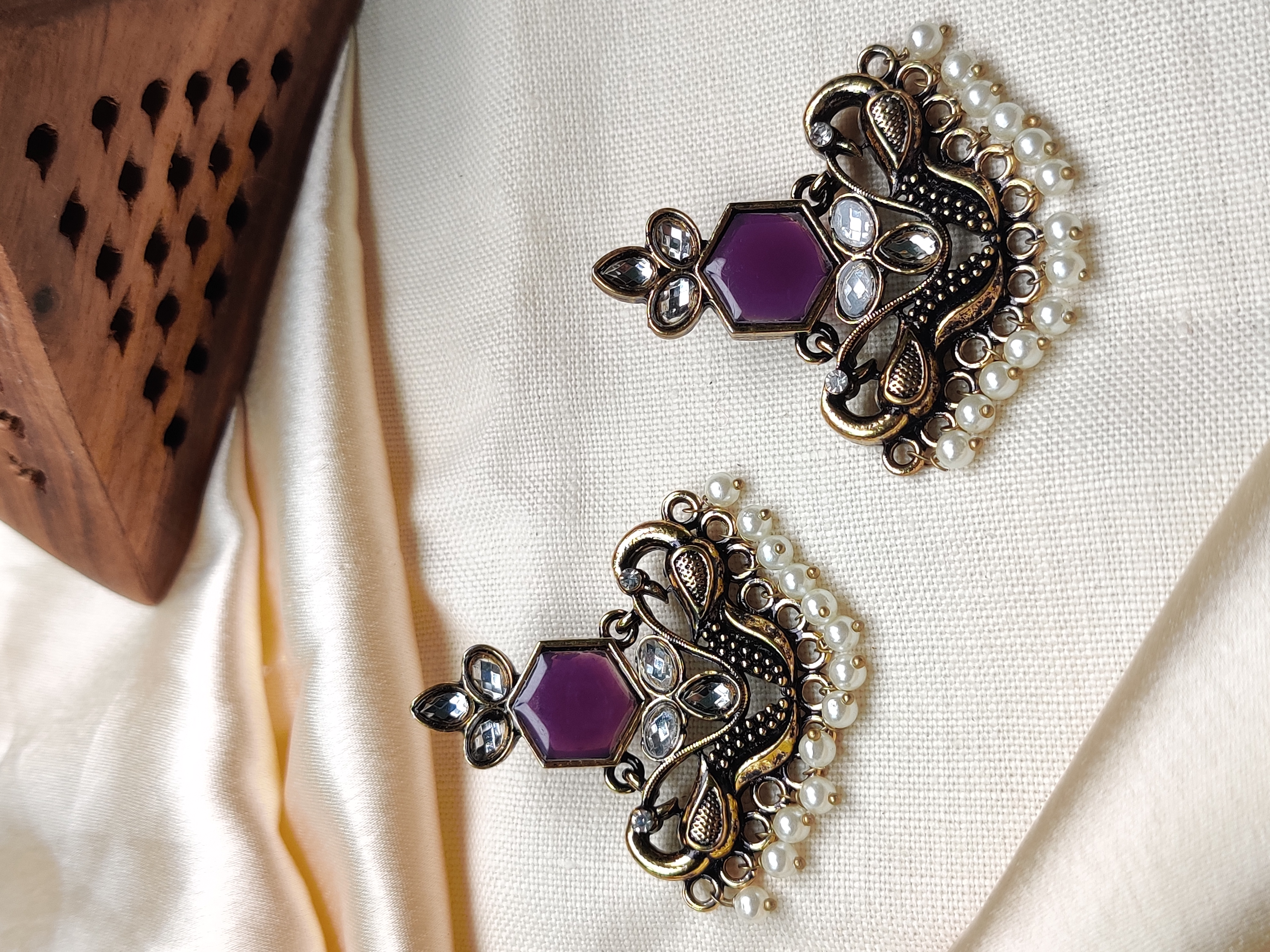 Golden peacock earrings with purple stone & pearl drops