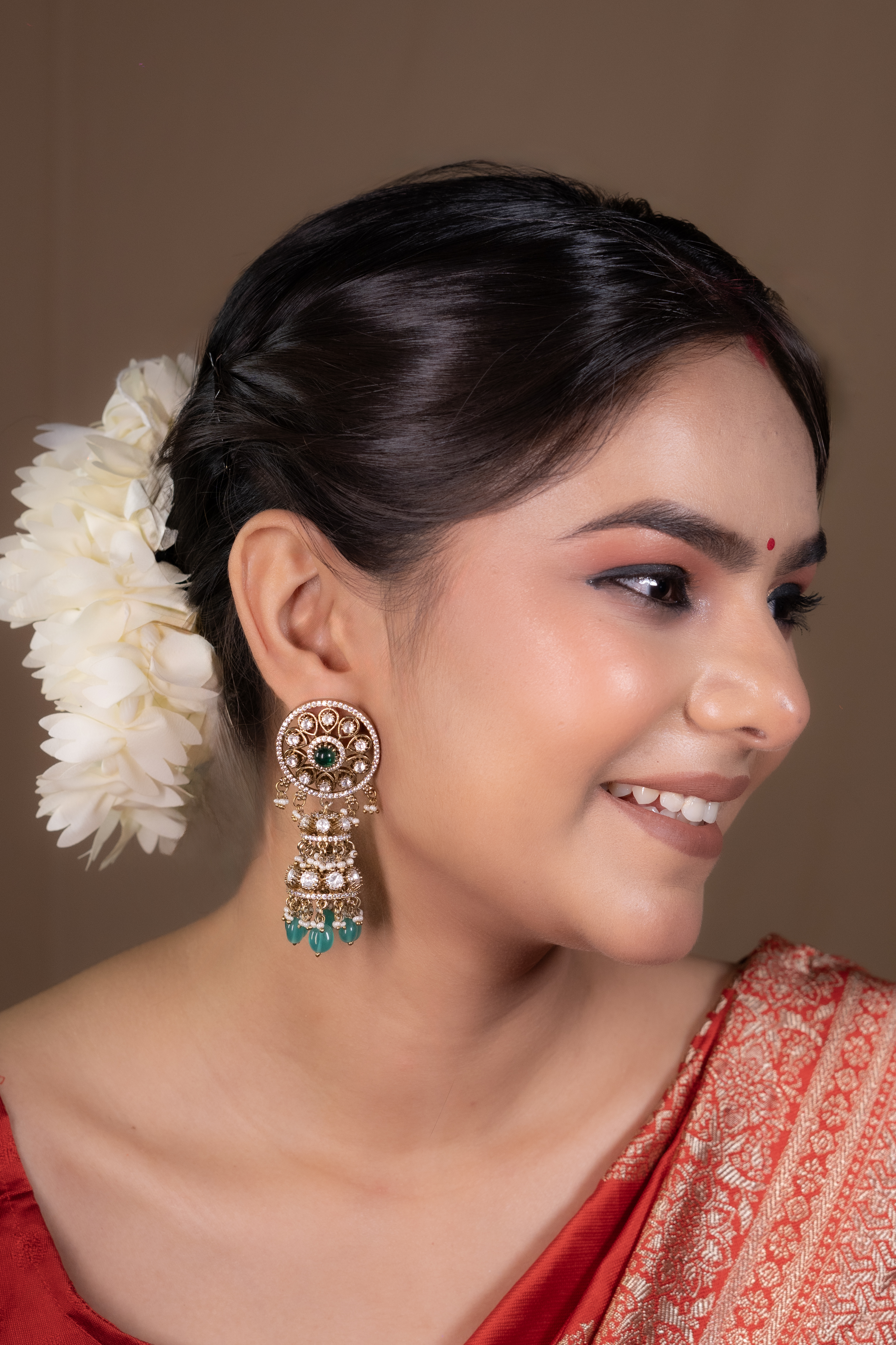 Emerald Spark Kundan Jhumkis