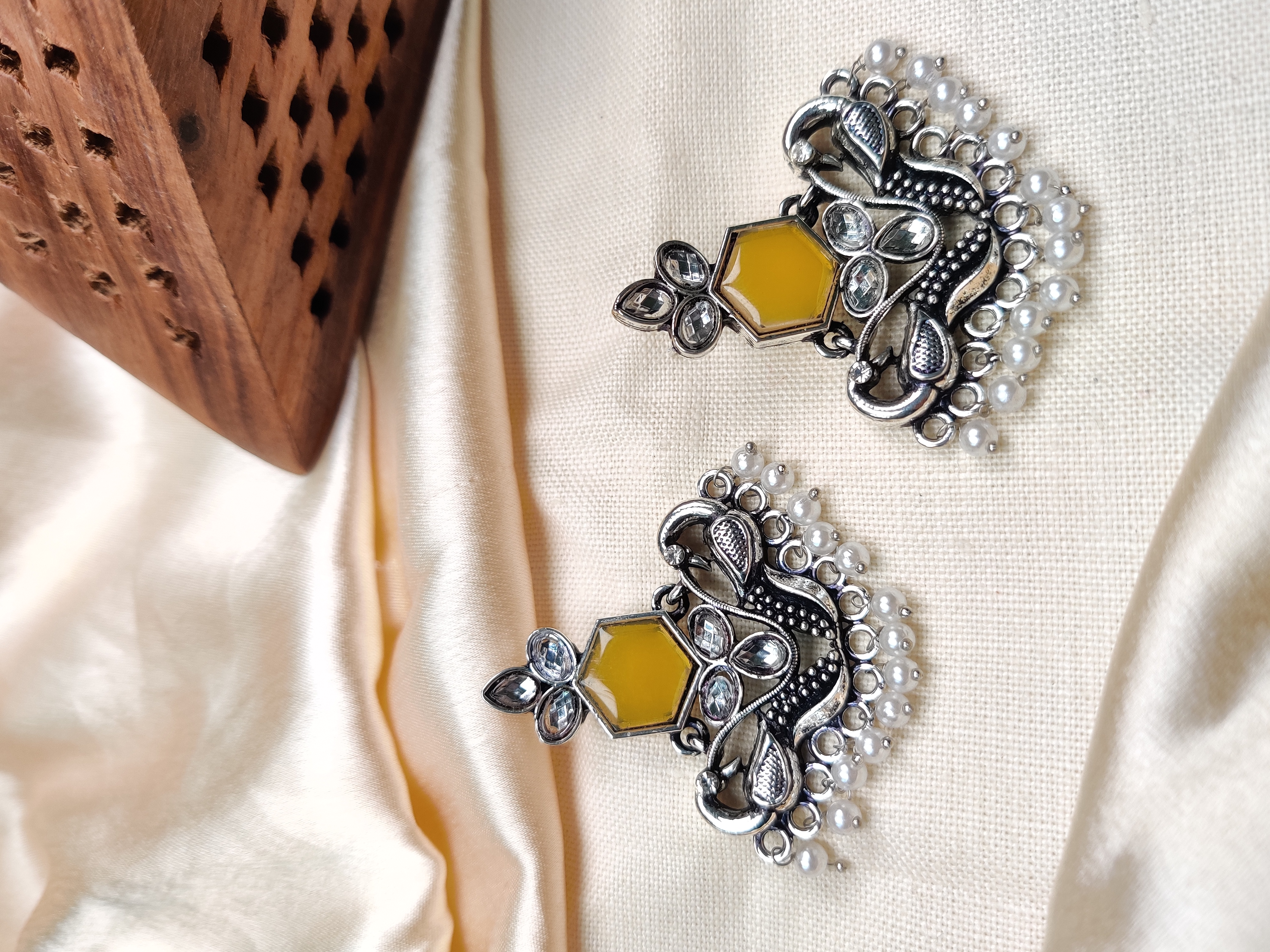 Silver peacock earrings with yellow stone & pearl beads