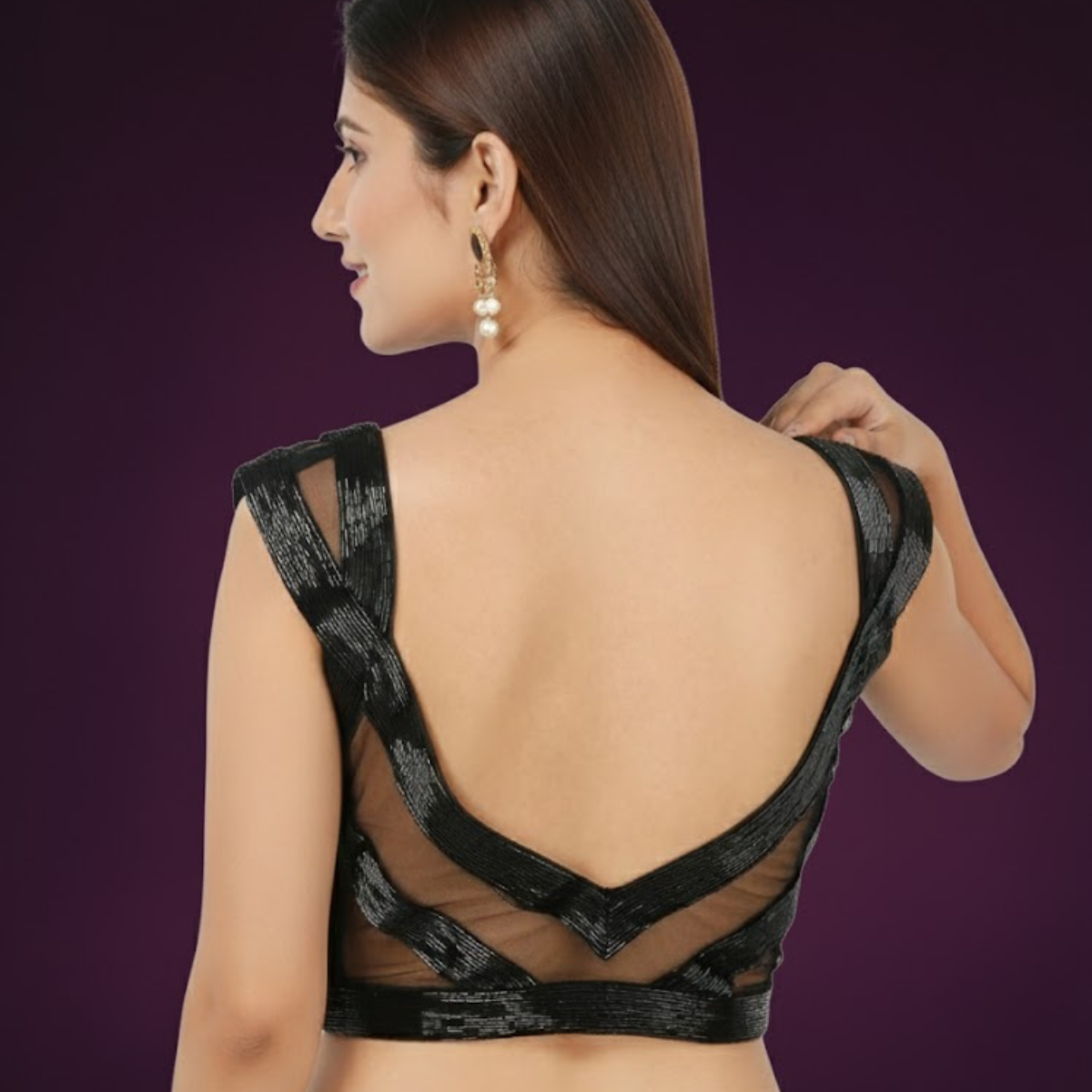Classy black low cut sleeveless blouse in smooth Bengal silk, fully hand embroidered, padded with side opening