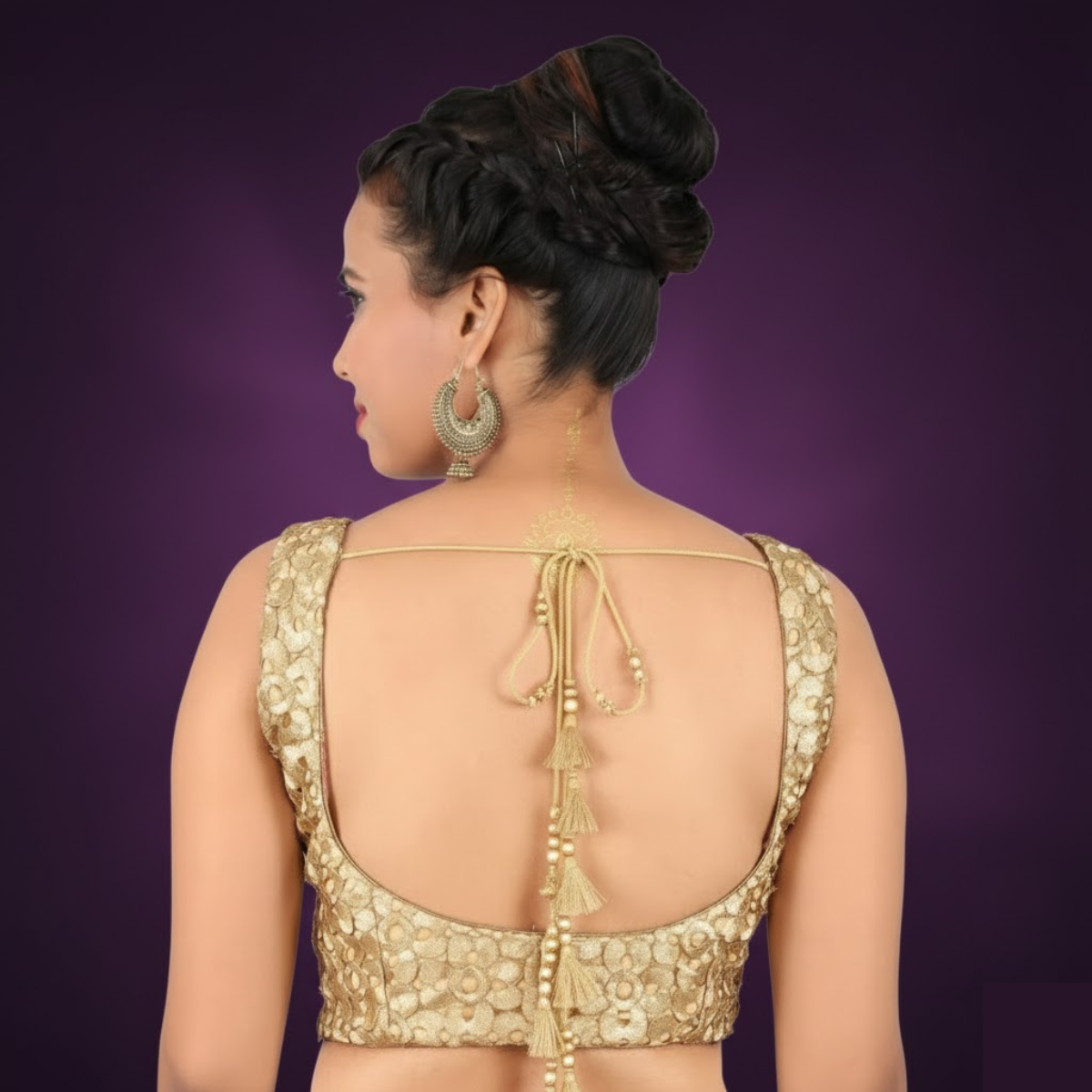 Elegant gold U-neck sleeveless brocade blouse with side opening.