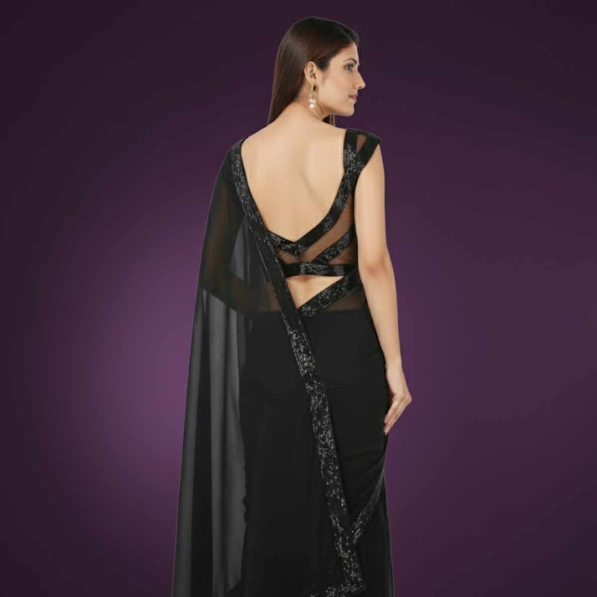 Classy black low cut sleeveless blouse in smooth Bengal silk, fully hand embroidered, padded with side opening