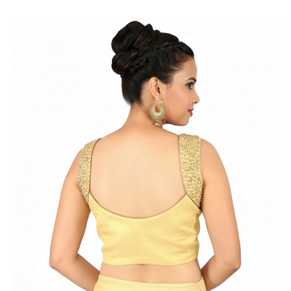 Designer gold blouse with embroidered arm band and side opening.