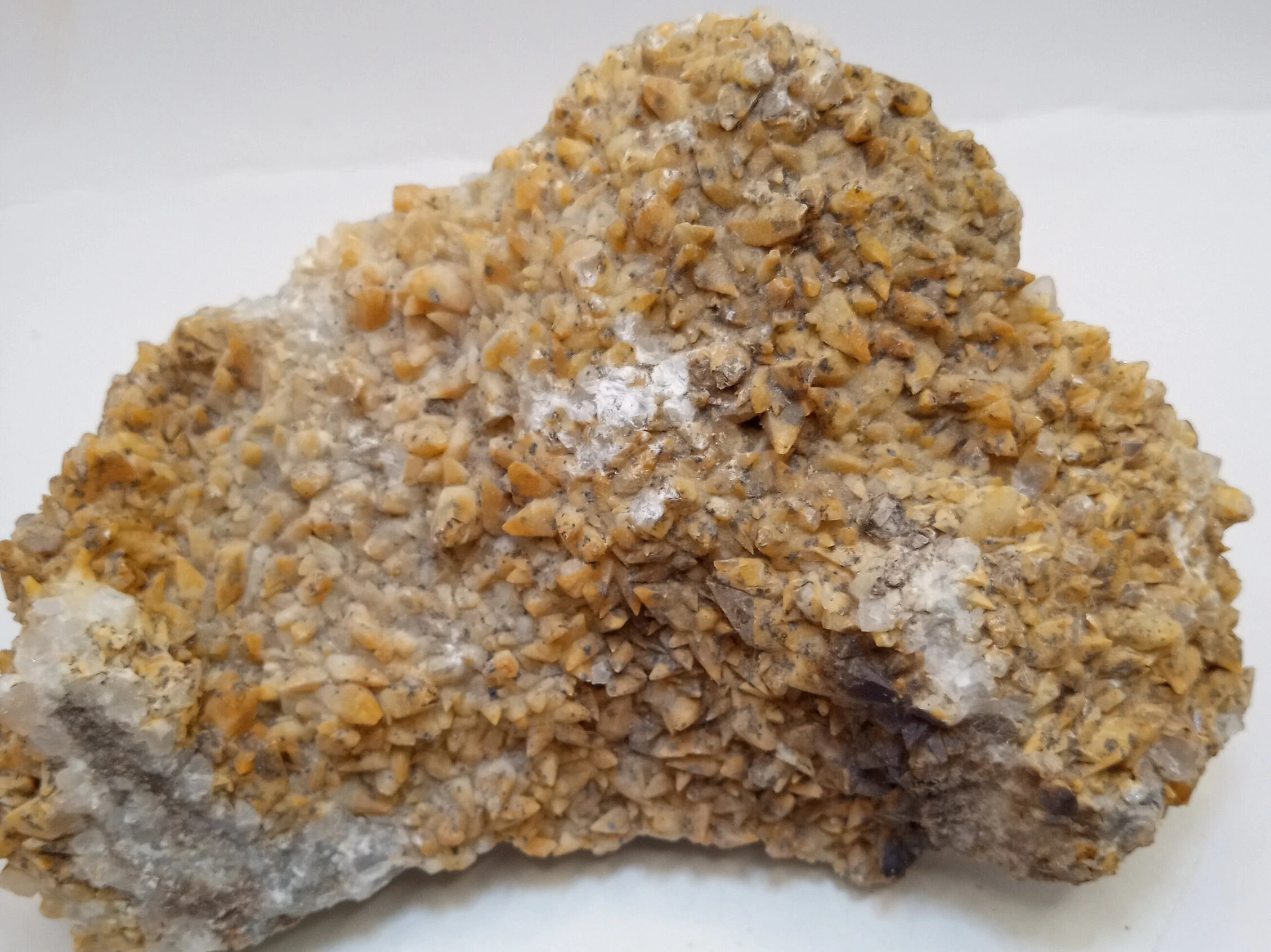 Dogtooth Calcite is a Calcite that forms as multiple scalenohedral crystals.