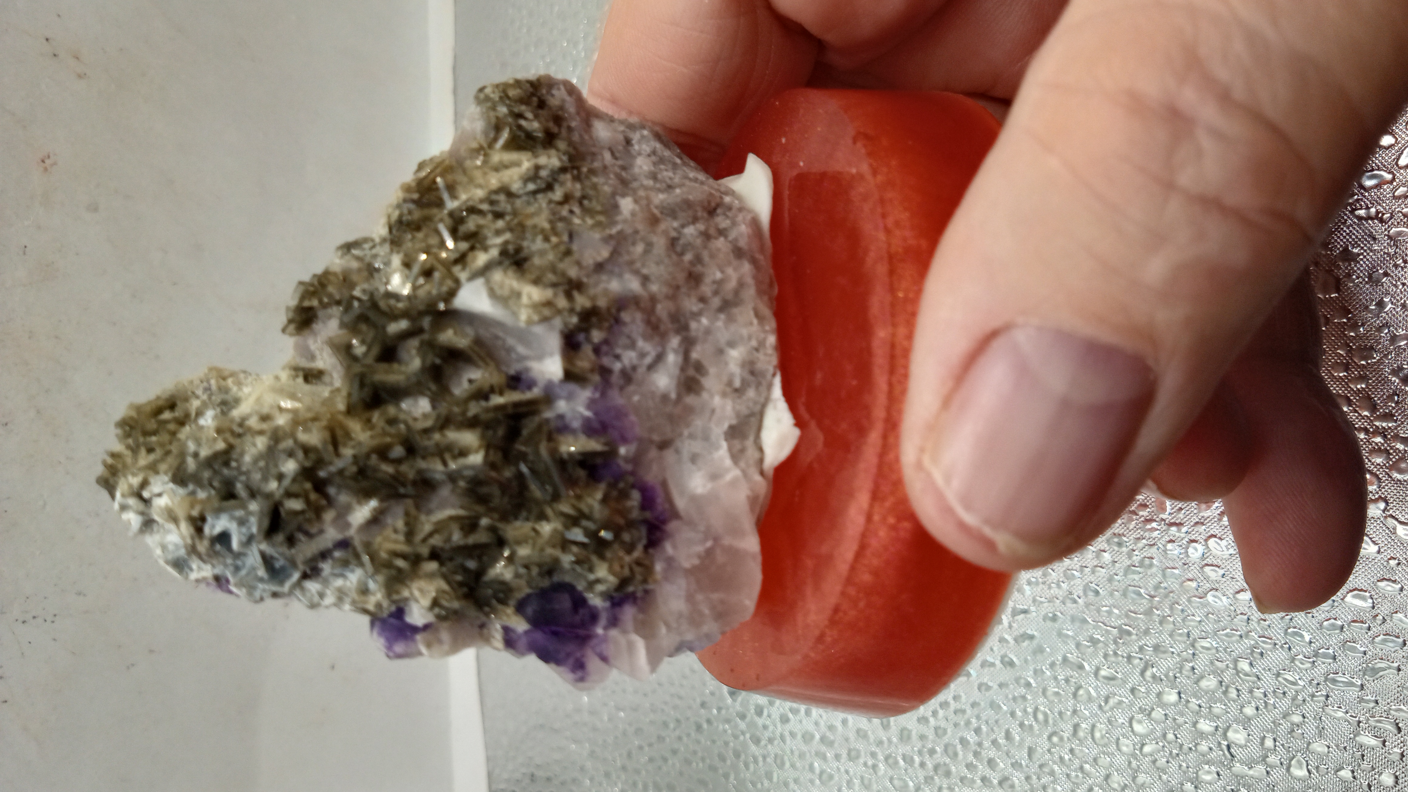 Black Siderite Mineral on Red Stand - Bisbee Arizona