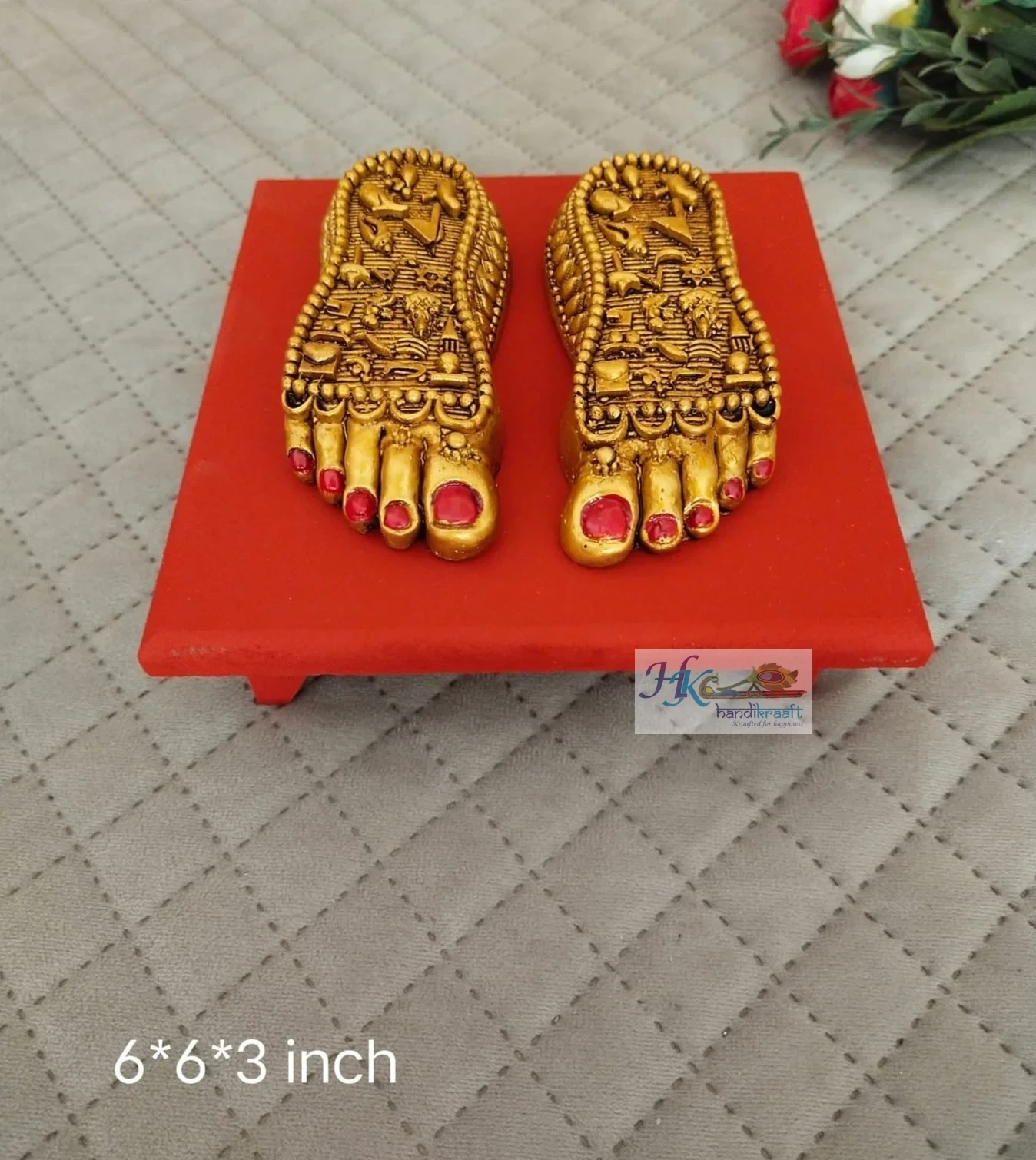 Golden Lakshmi Paduka on Red Pedestal