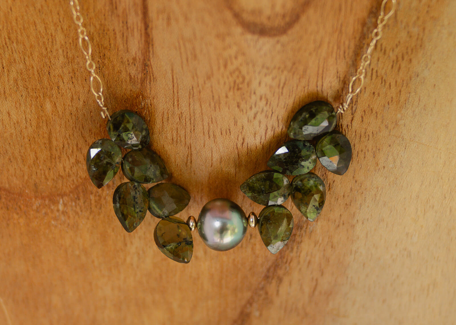 Tahitian Pearl embraced by Grossular Garnets in natural design