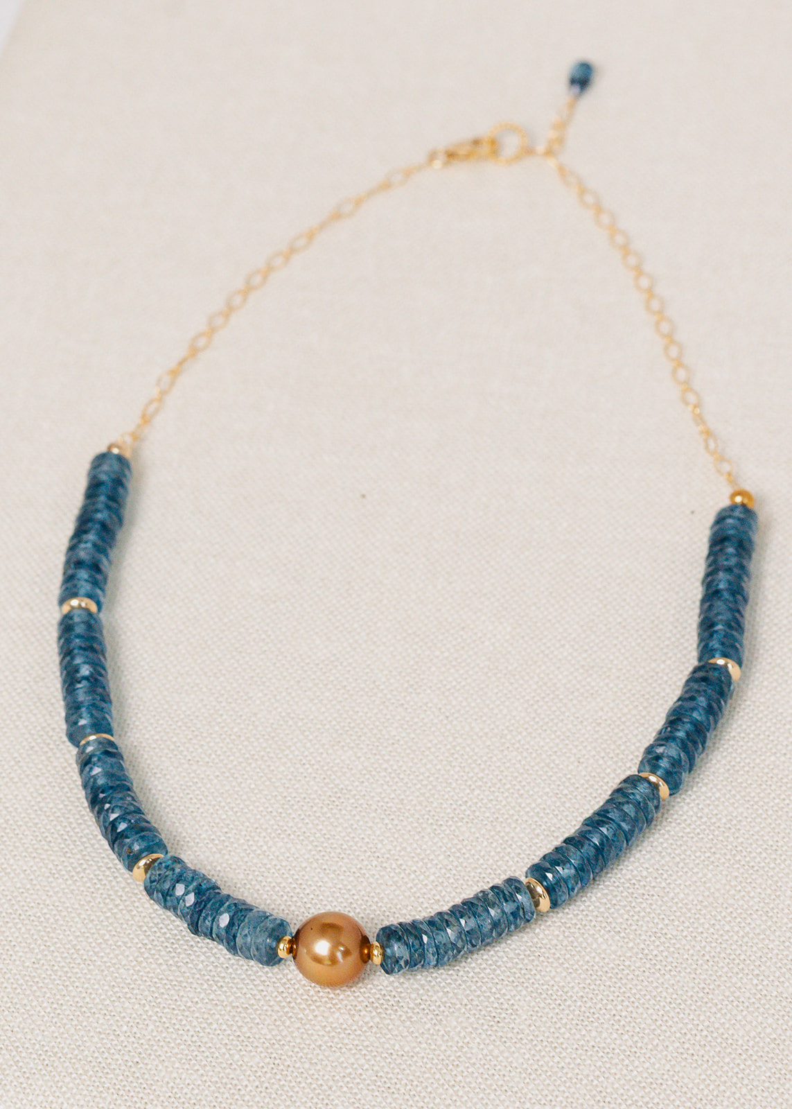 Shimmering London Blue Topaz with Golden South Sea Pearl