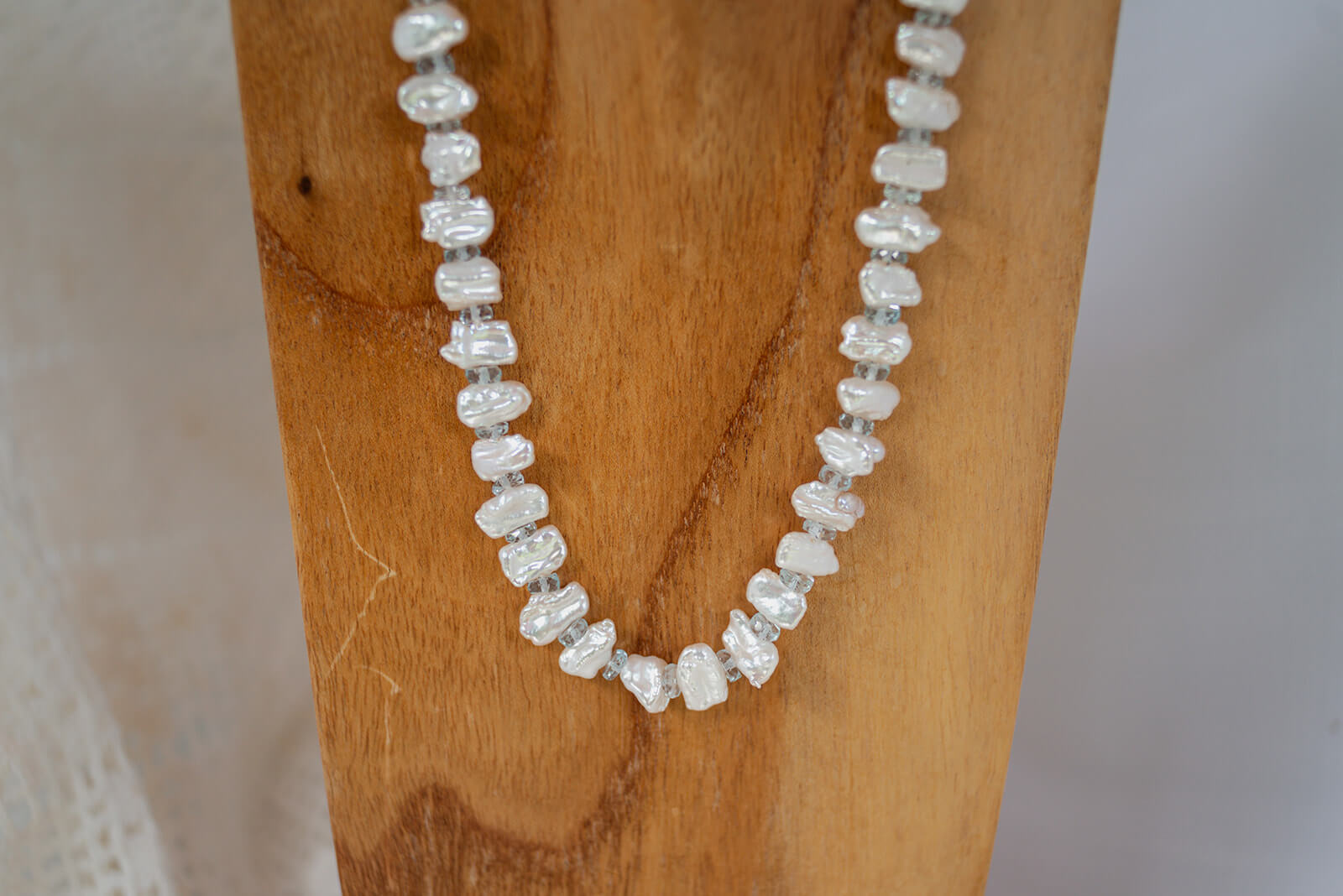 Keshi Pearls accented by faceted Aquamarine gems  