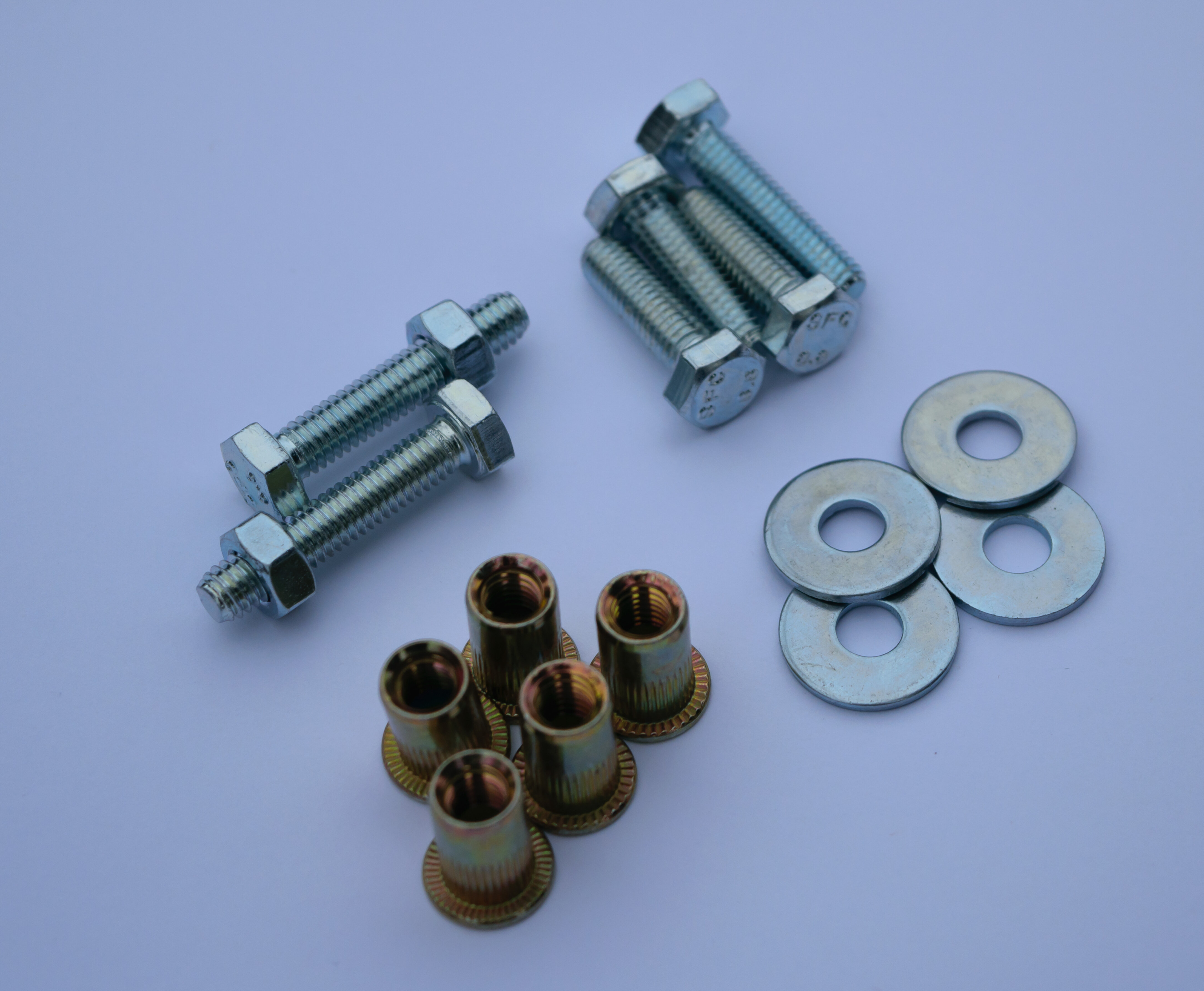 Passenger seat fire extinguisher bracket set