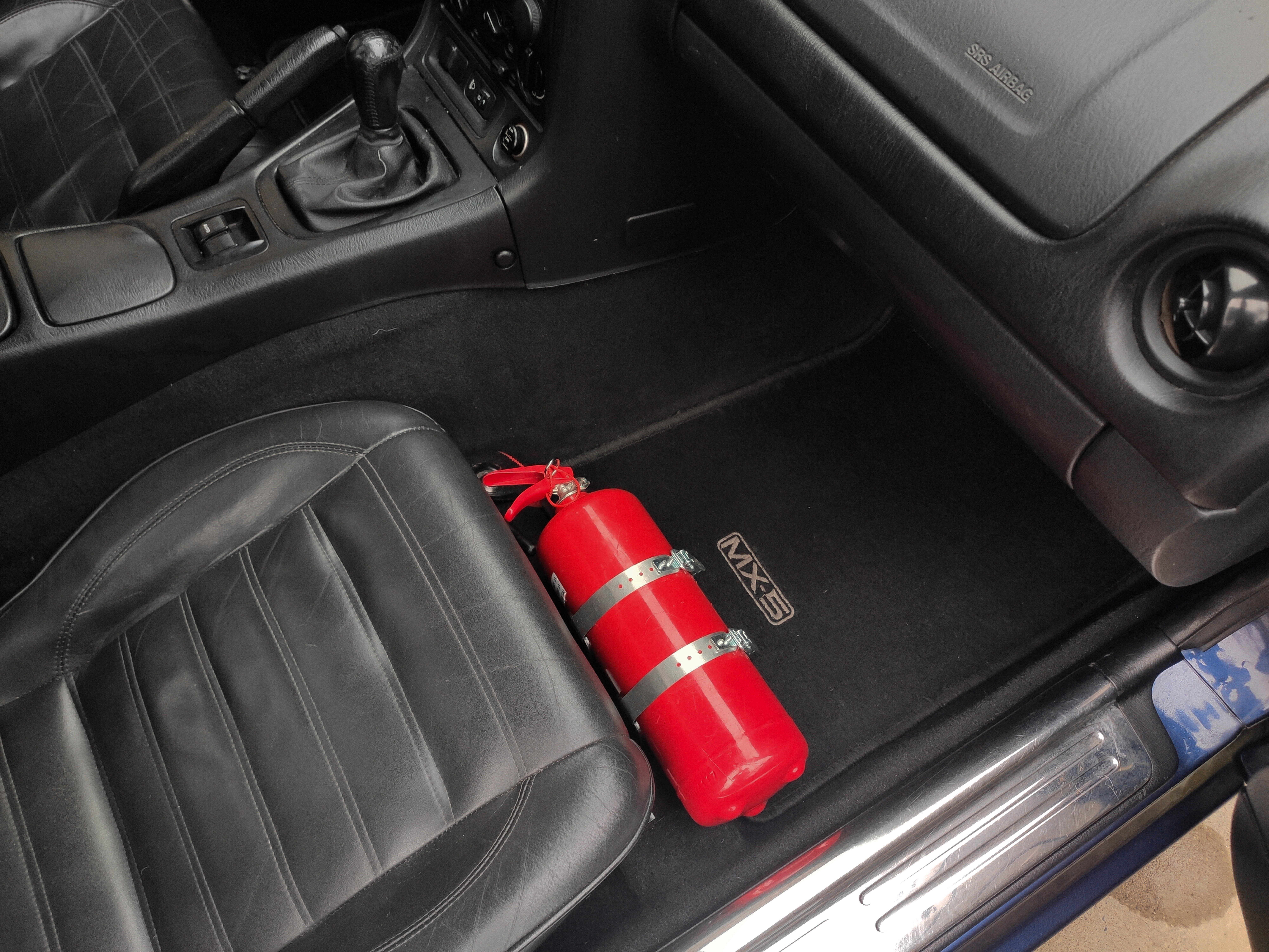 Passenger seat fire extinguisher bracket set