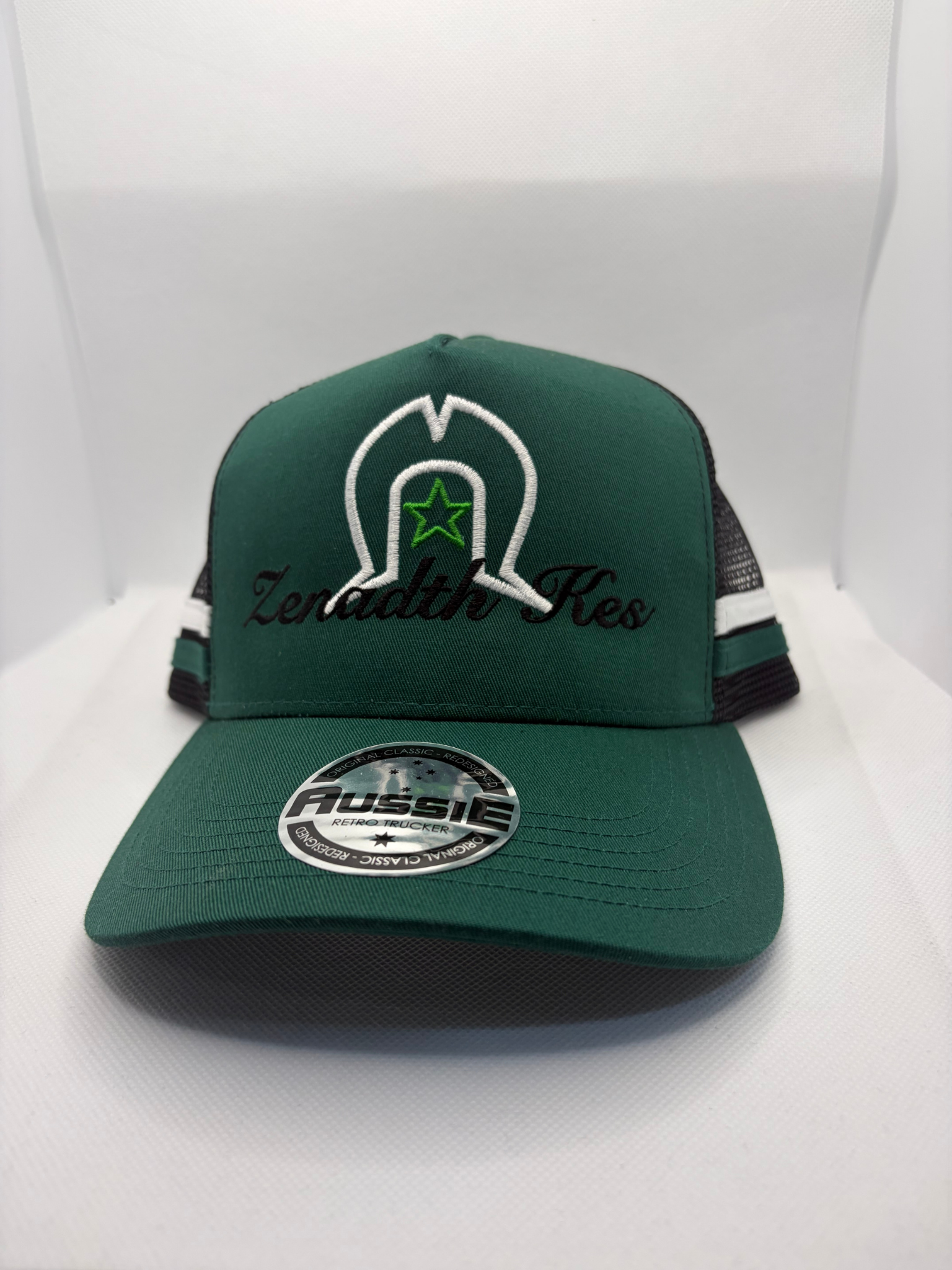 Torres Strait Island Dhoeri with Star and Zenadth Kes Embroidered on Green/Black Trucker Cap with White/Green Side Stripes