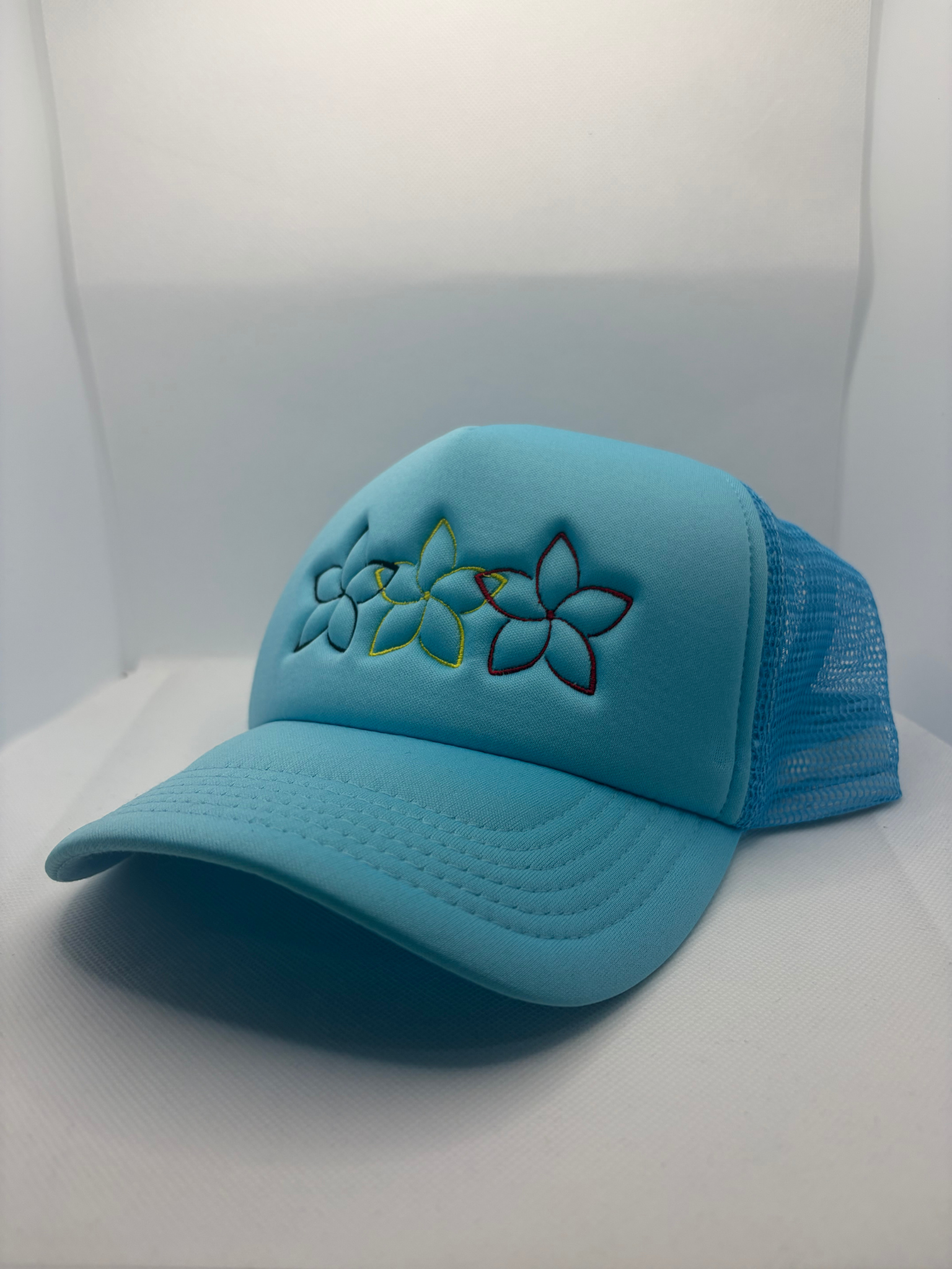 Black, Yellow & Red Flowers Embroidered on Sky Blue Polymesh Trucker Cap