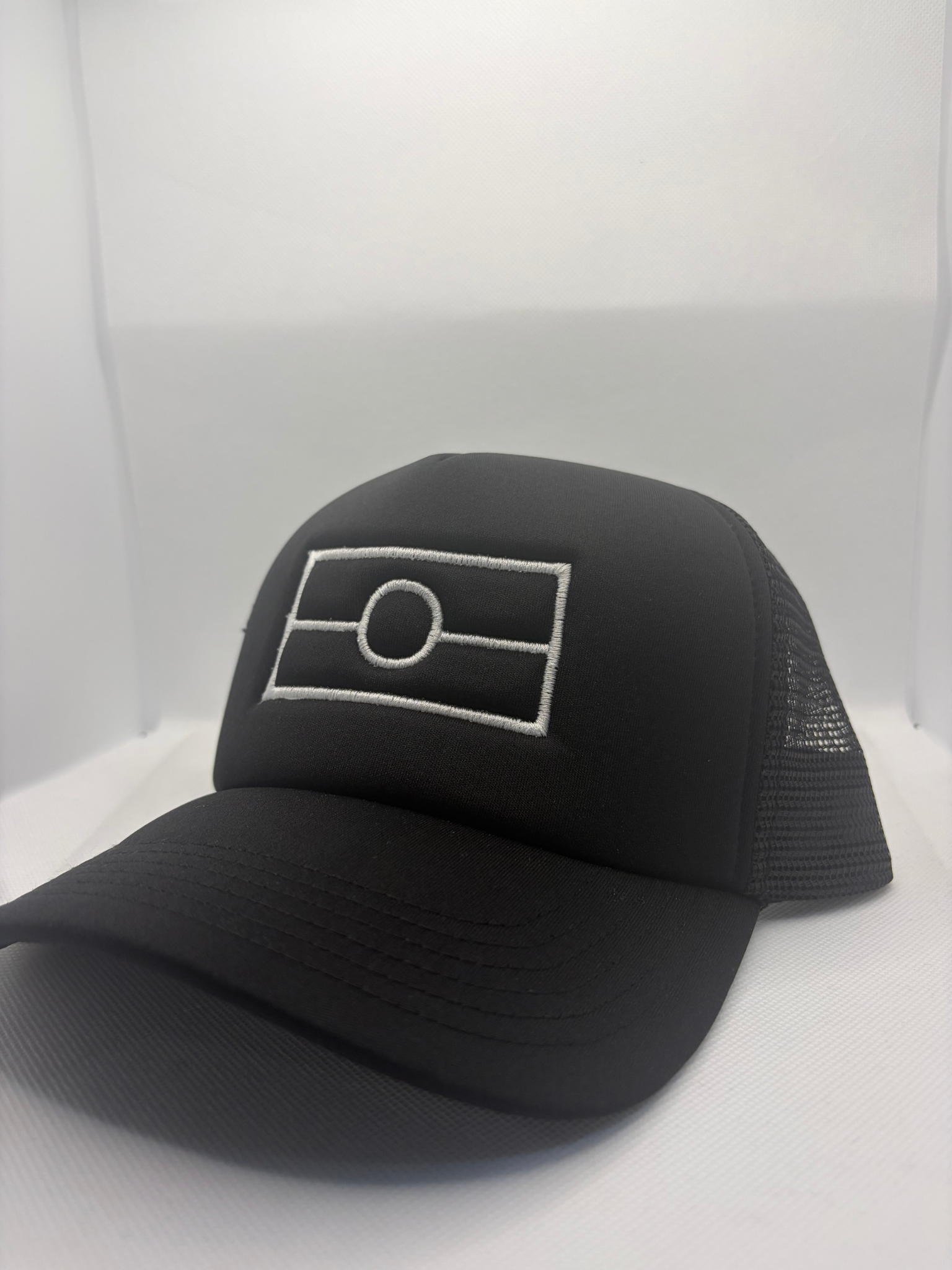 Aboriginal Flag embroidered on black polymesh trucker cap