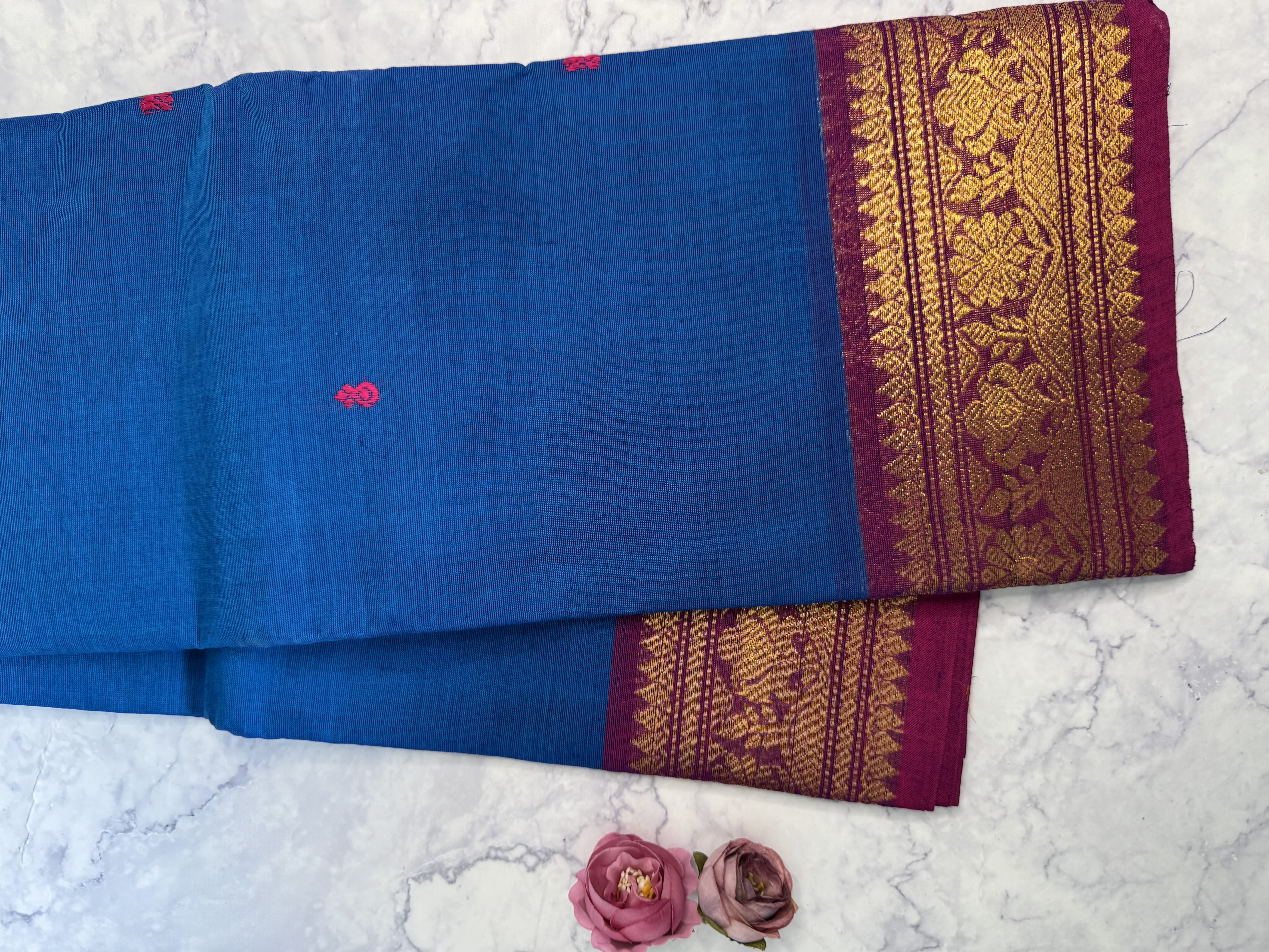 Bright blue cotton saree with pink border