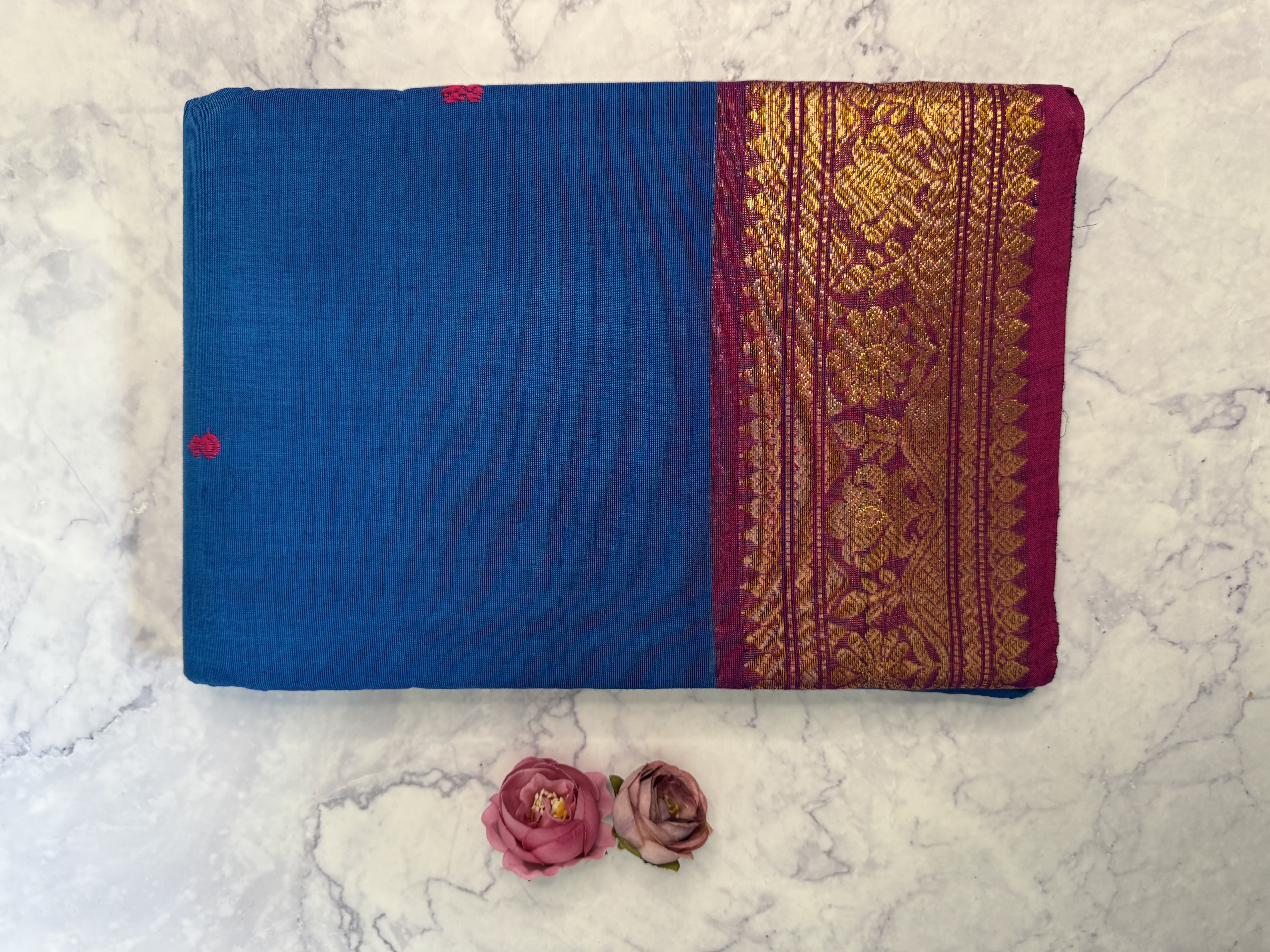 Bright blue cotton saree with pink border