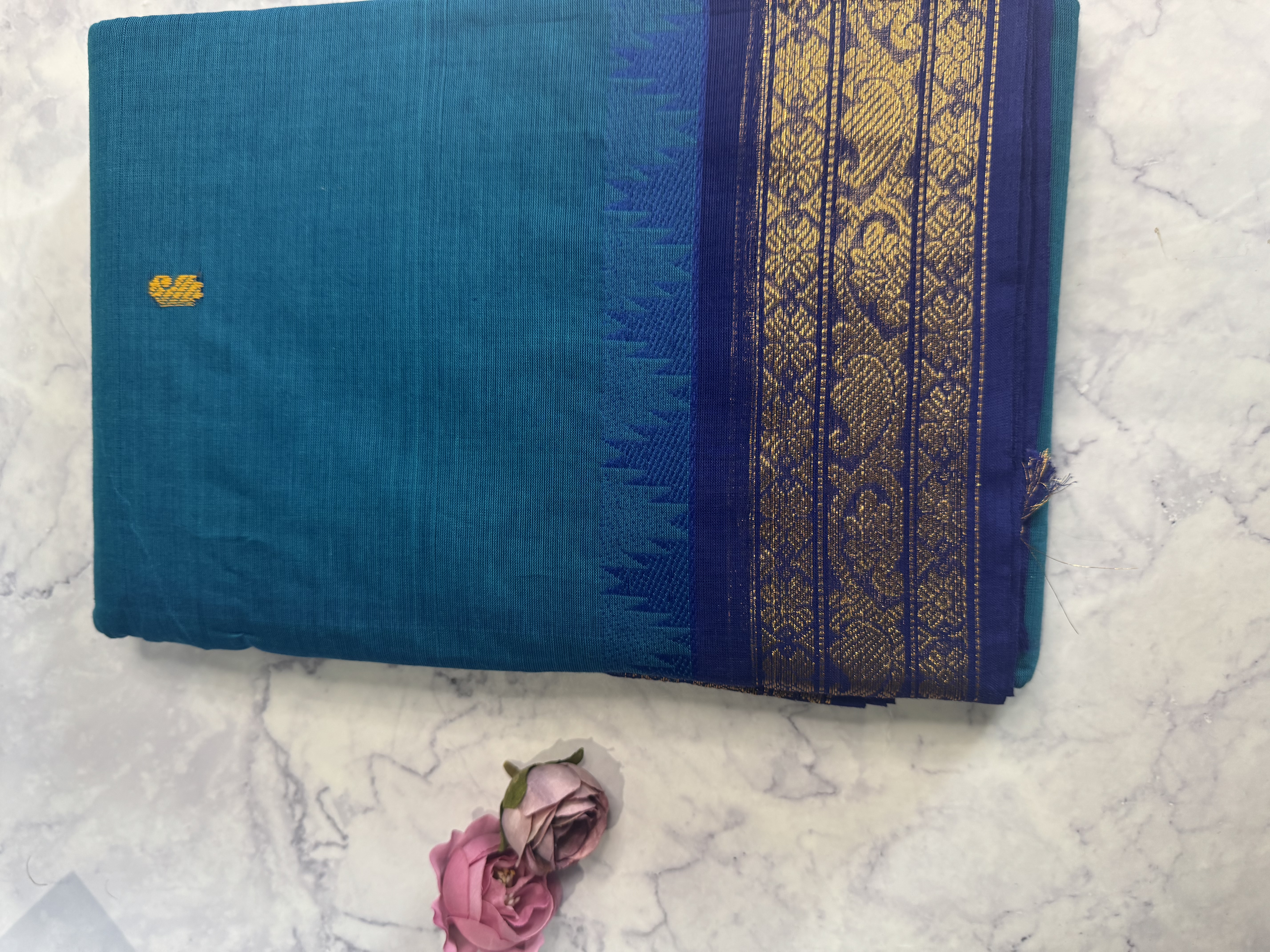 Peacock blue cotton saree with classic border