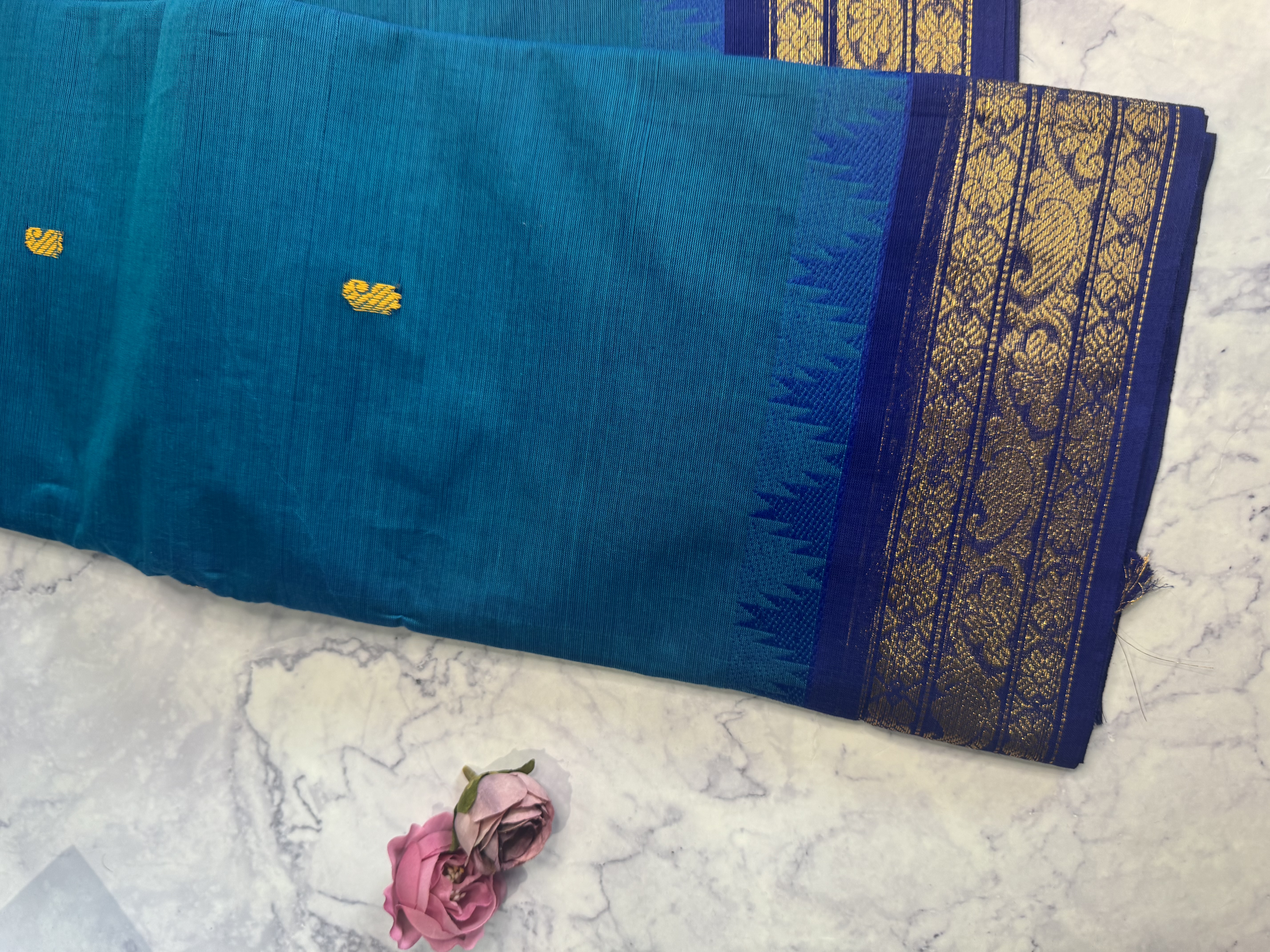 Peacock blue cotton saree with classic border