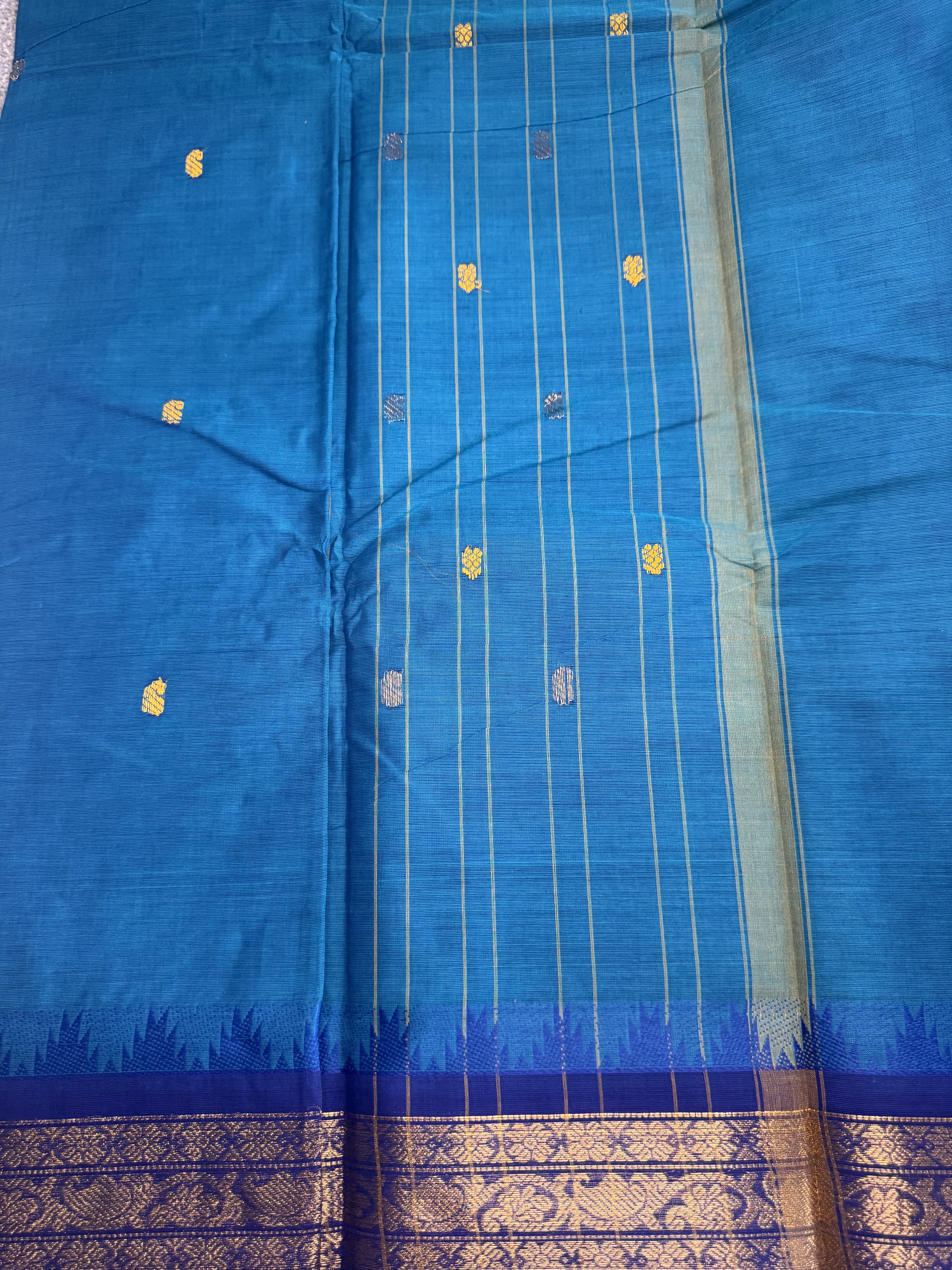 Peacock blue cotton saree with classic border