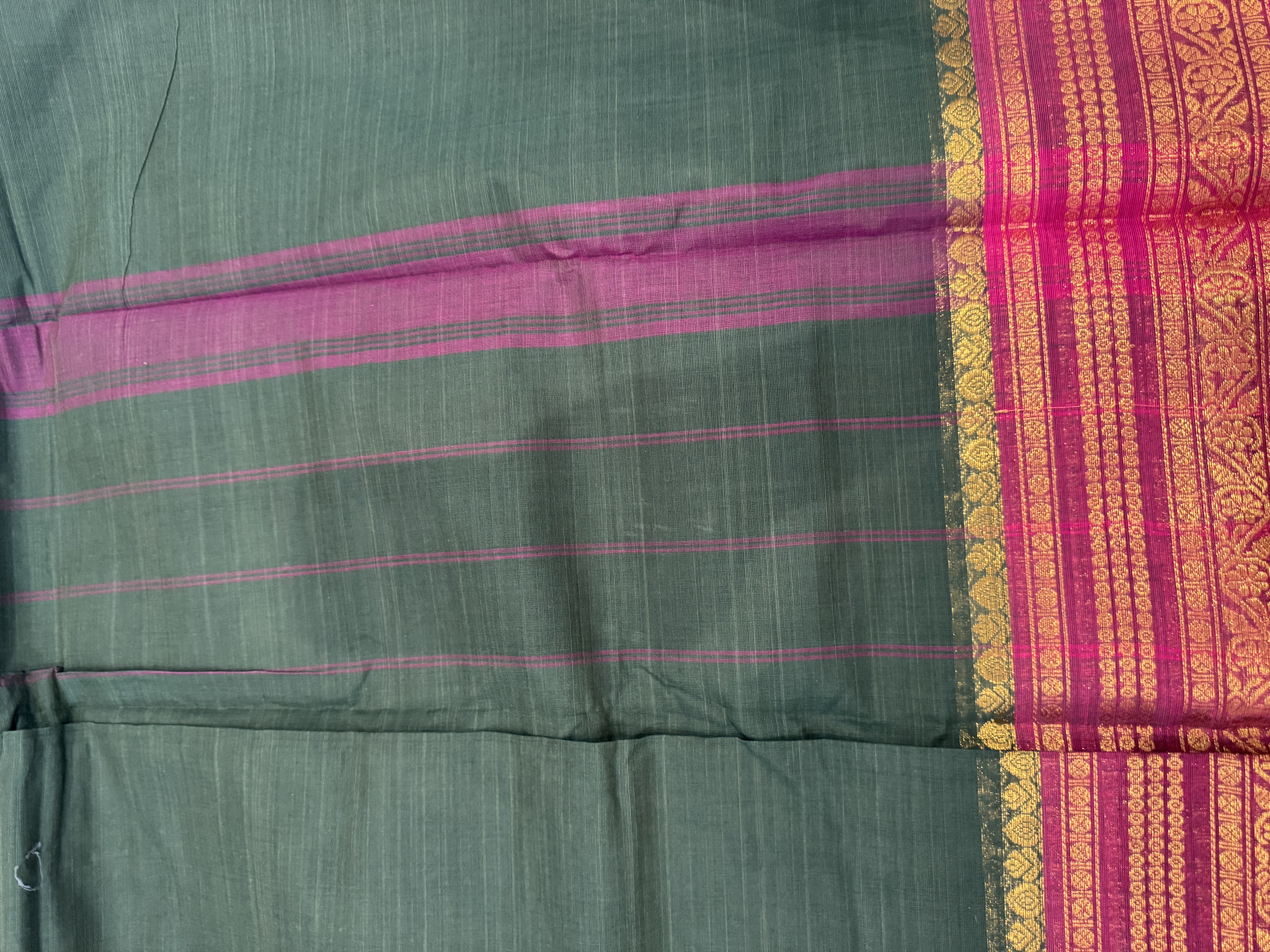 Forest green cotton saree with pink border