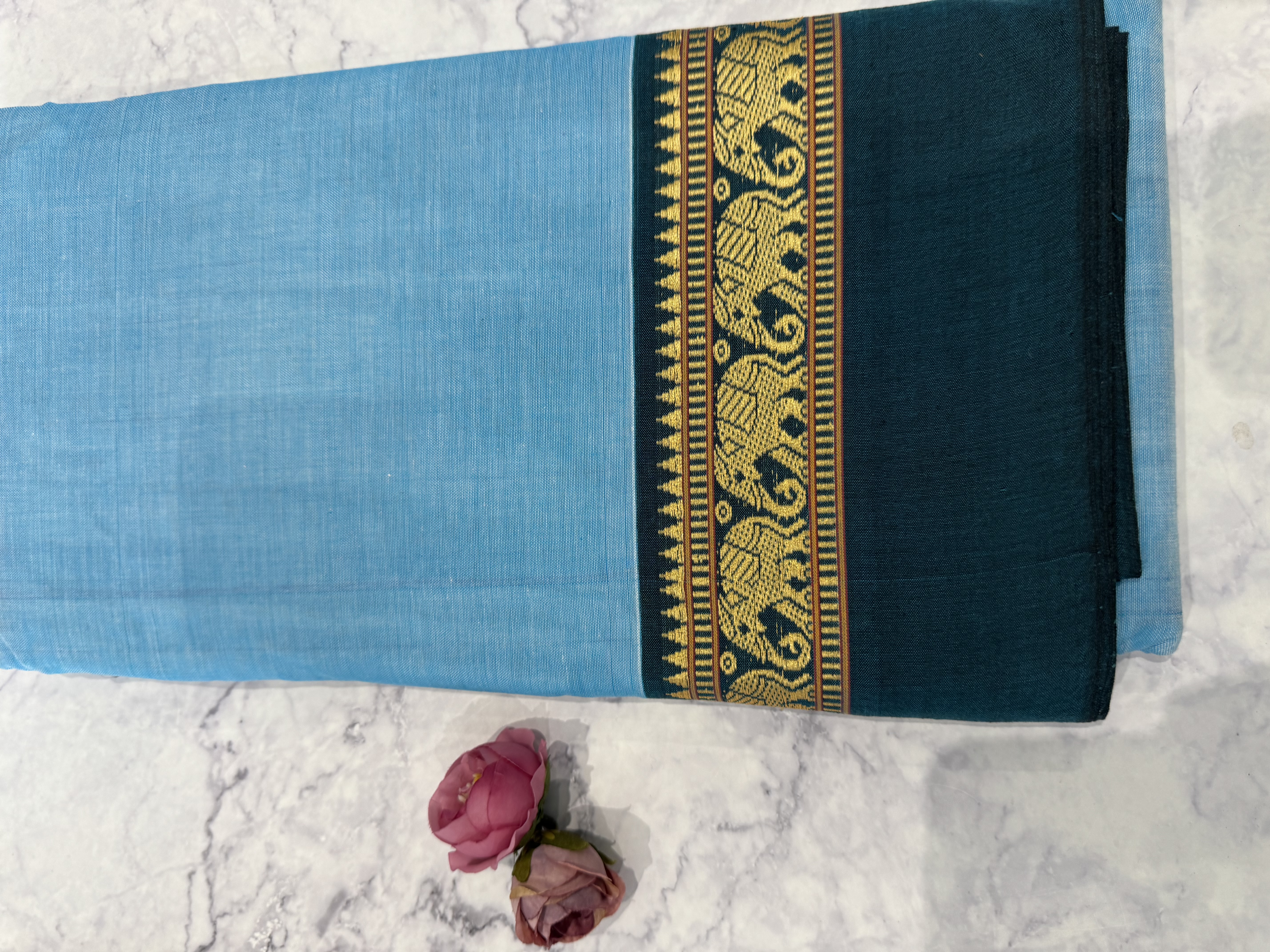Baby blue cotton saree with teal border