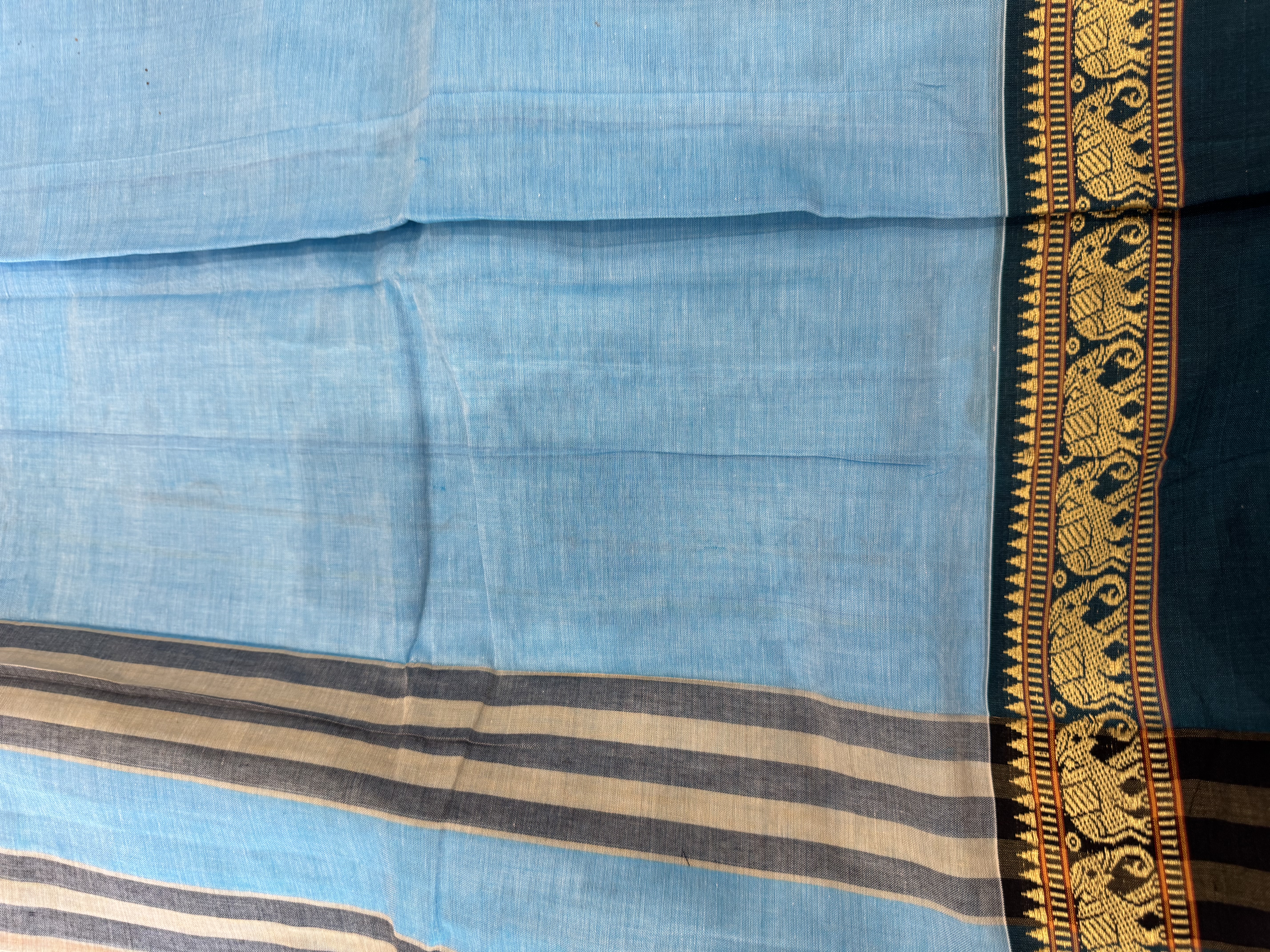 Baby blue cotton saree with teal border