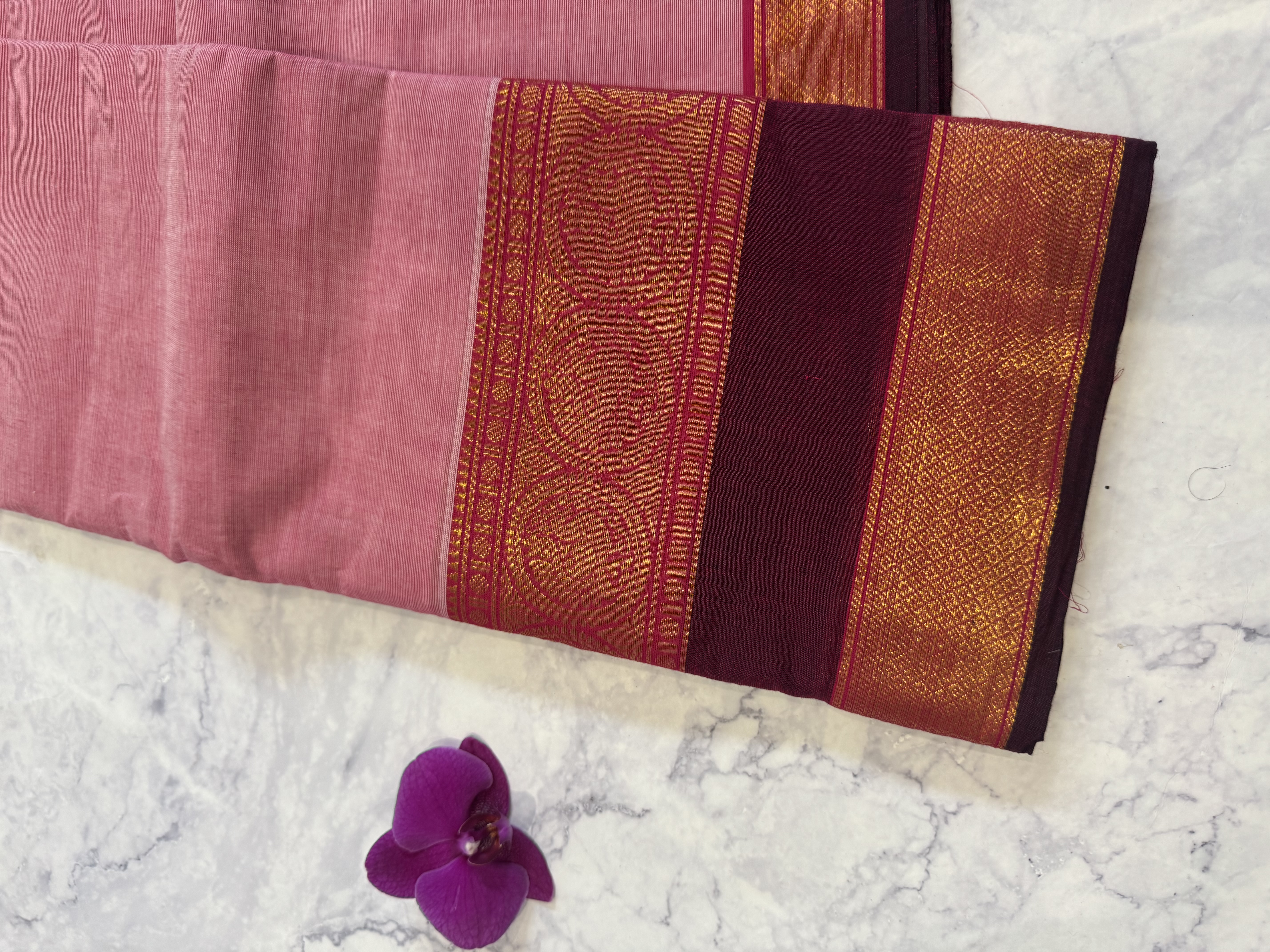 Pastel pink cotton saree with plum border