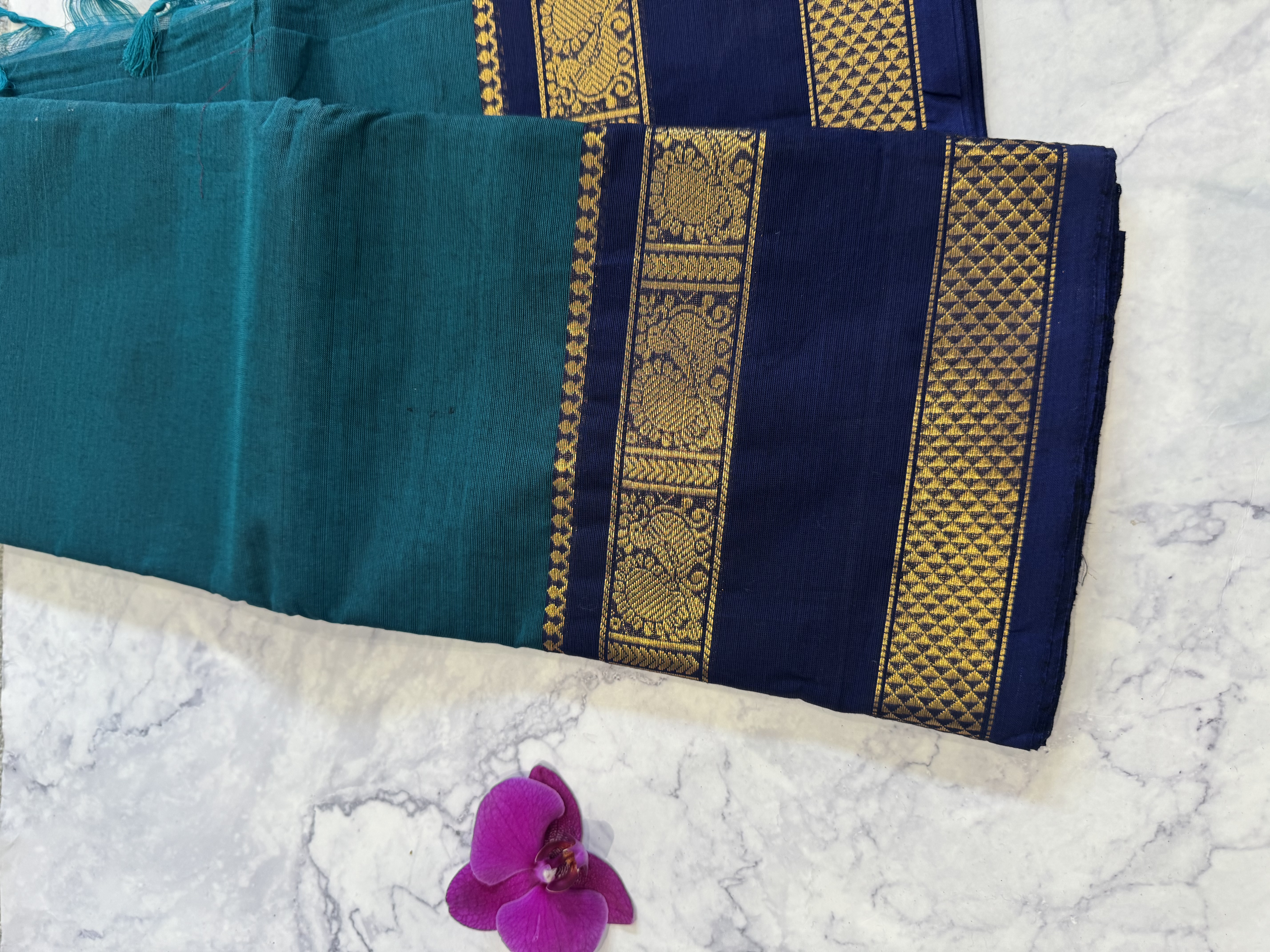 Teal cotton saree with navy blue border
