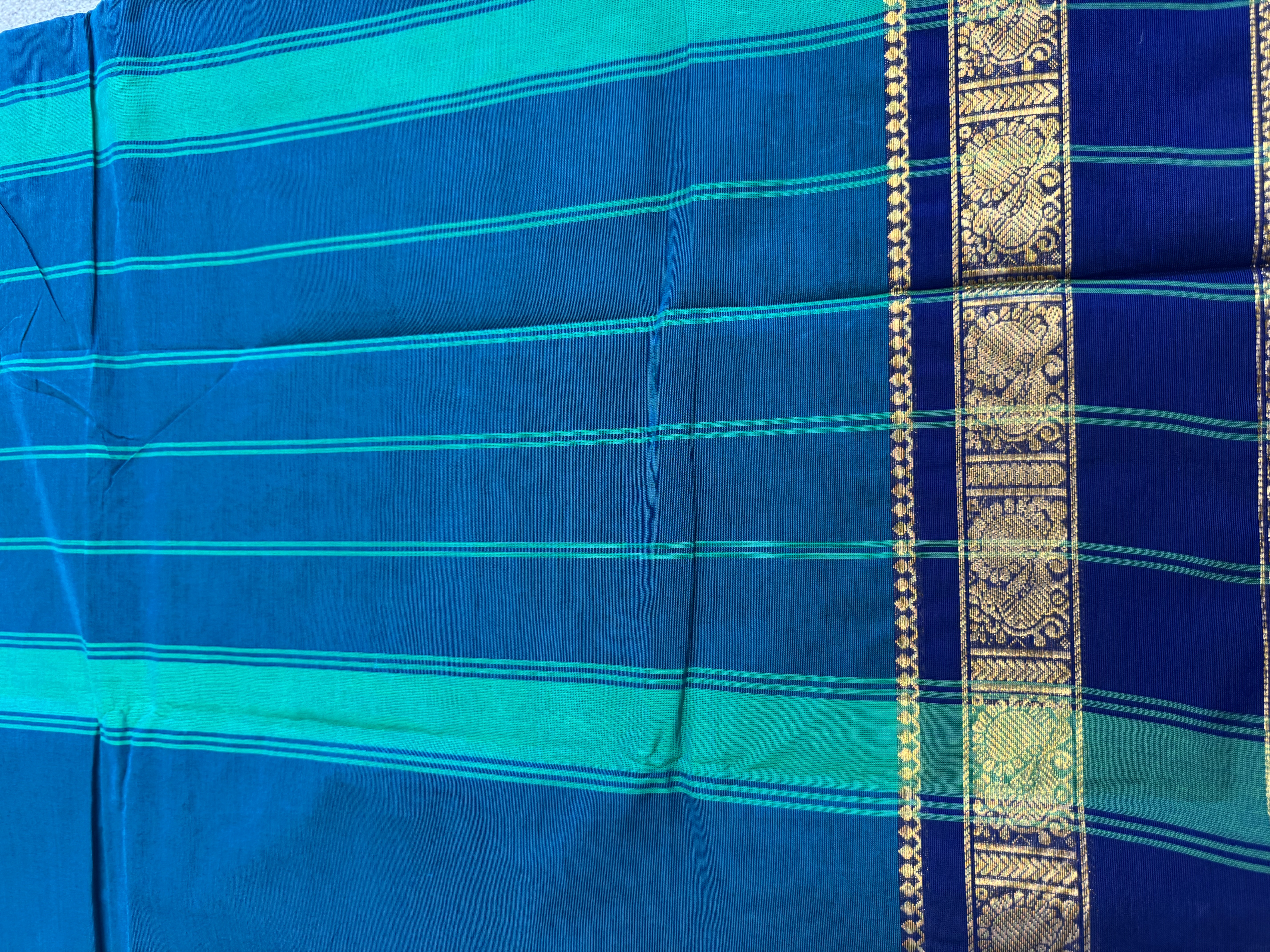 Teal cotton saree with navy blue border